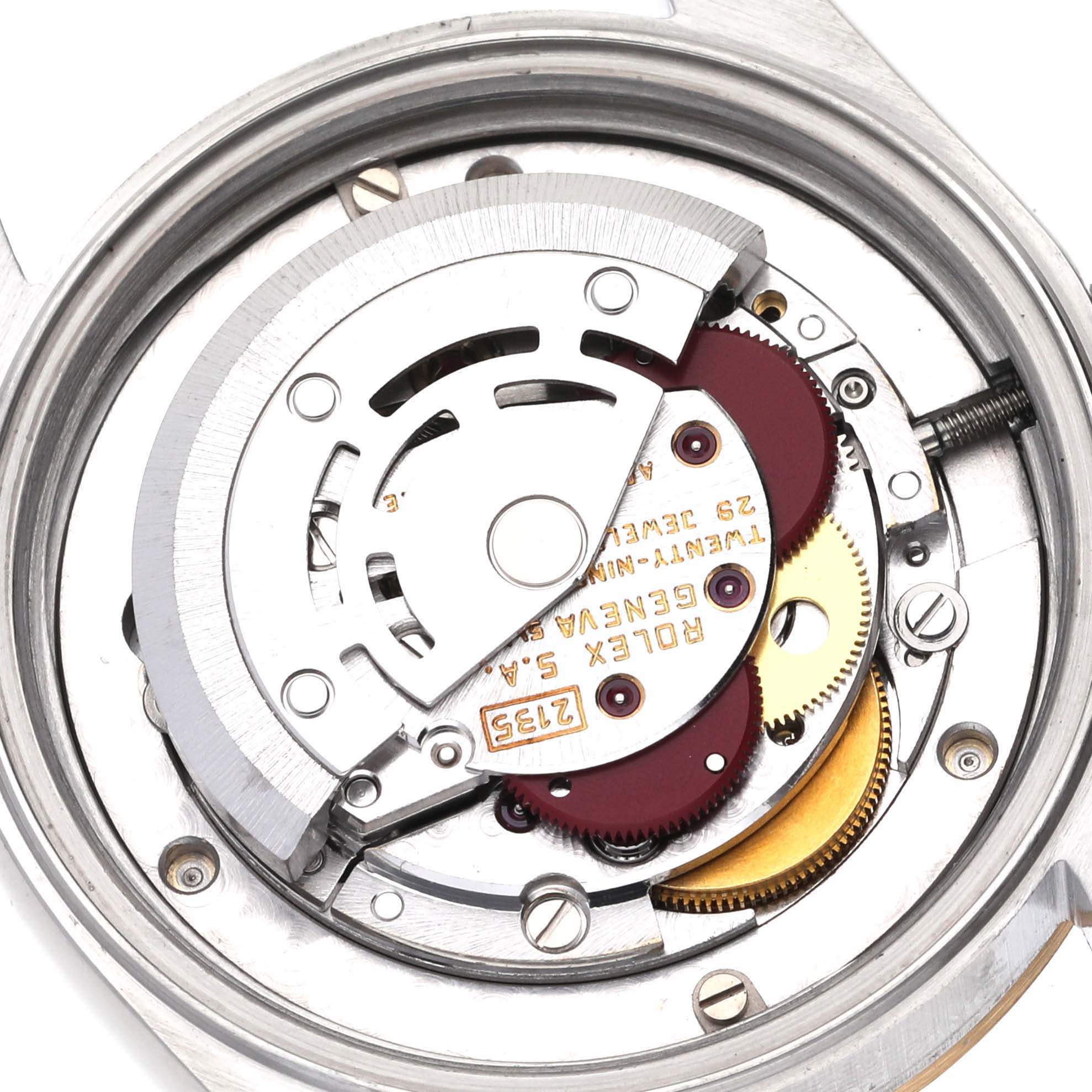 The image shows an internal view of the Rolex Mid-Size 68273 Women's Steel and Gold (two tone) Champagne Dial 68273 Women's Steel and Gold (two tone) Champagne Dial watch movement, displaying the rotor, gears, and other mechanical components.