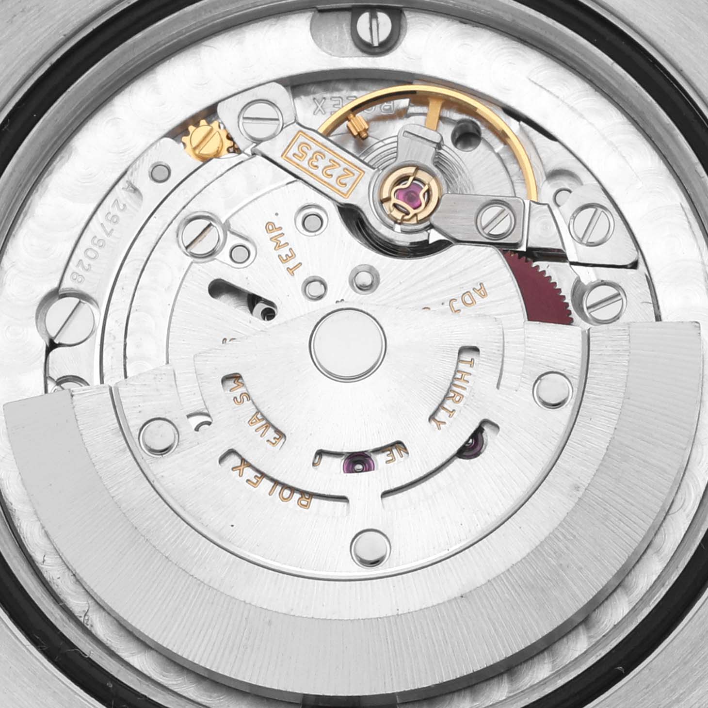 The image shows the intricate movement mechanism of a Rolex Mid-Size 178384 Women
s Stainless Steel Mother of Pearl Dial 178384 Women
s Stainless Steel Mother of Pearl Dial watch from a directly overhead angle.