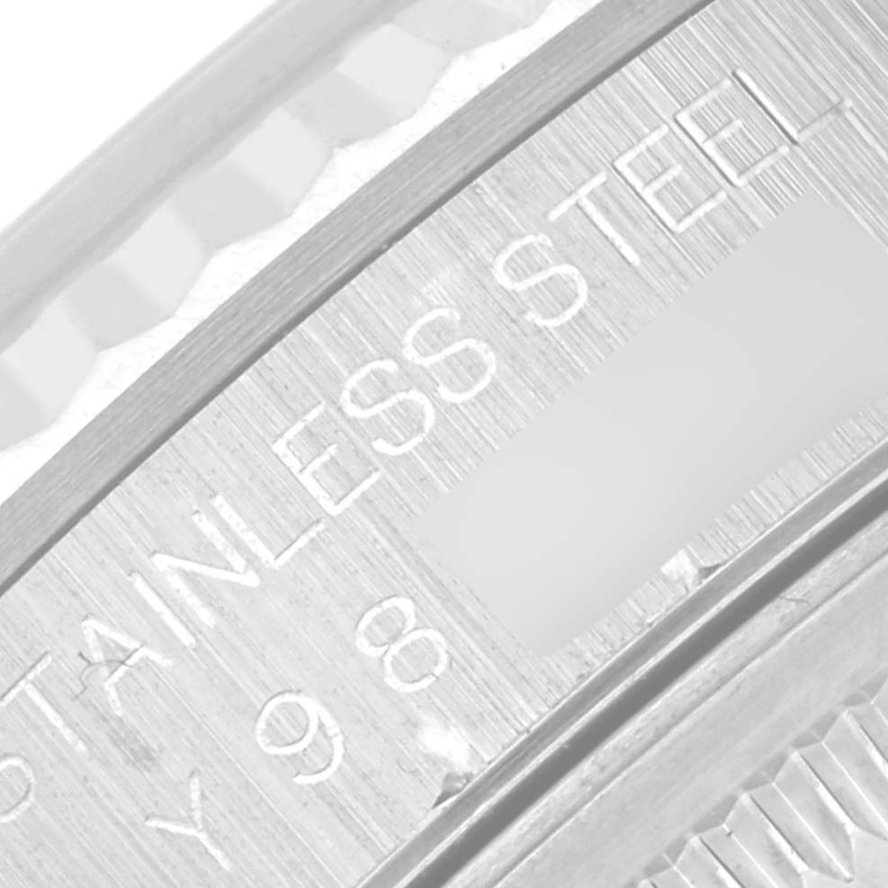 This is a close-up image showing the case side of a Rolex Datejust 16234 Men's Stainless Steel Silver Dial 16234 Men's Stainless Steel Silver Dial, highlighting the "STAINLESS STEEL" engraving.