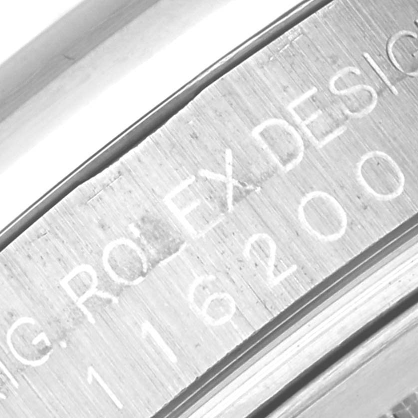 This image shows a close-up of the inner caseback engraving on a Rolex Datejust 116200 Men
s Stainless Steel Silver Dial 116200 Men
s Stainless Steel Silver Dial watch.