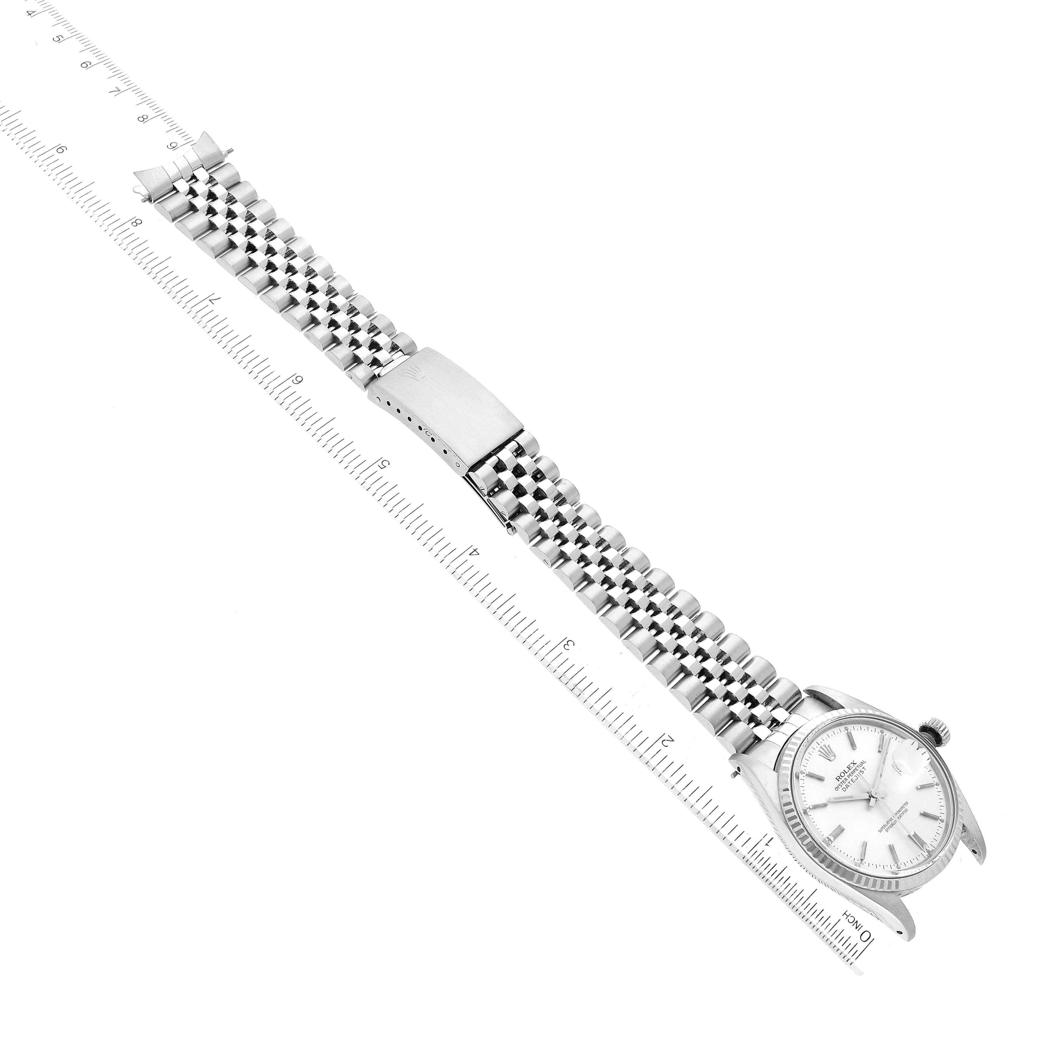 The image shows a Vintage Collection Rolex watch laid flat with the face and bracelet visible, next to a measuring ruler.