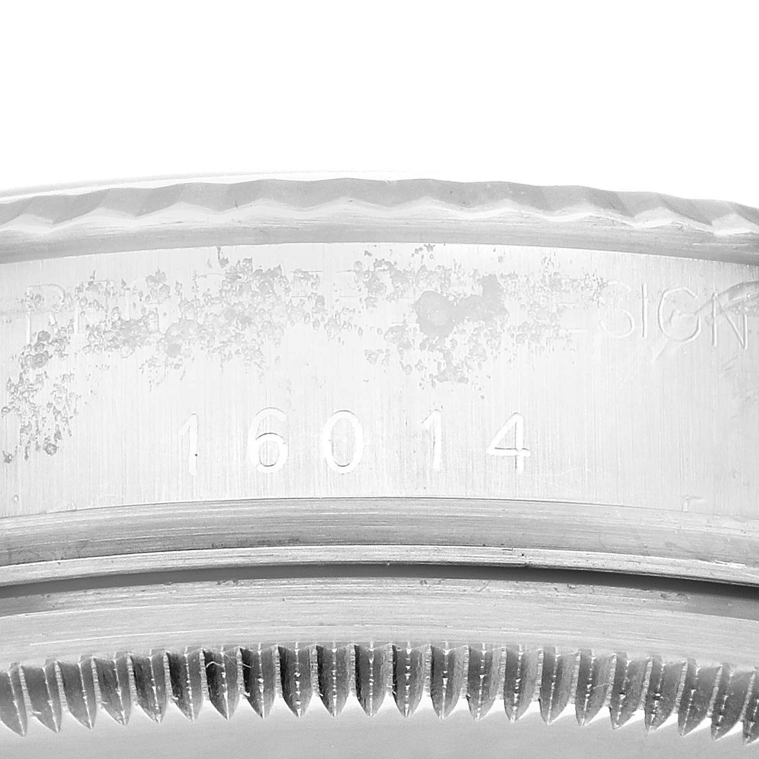 This close-up image shows the engraved model number and the bezel of the Vintage Collection Rolex watch.