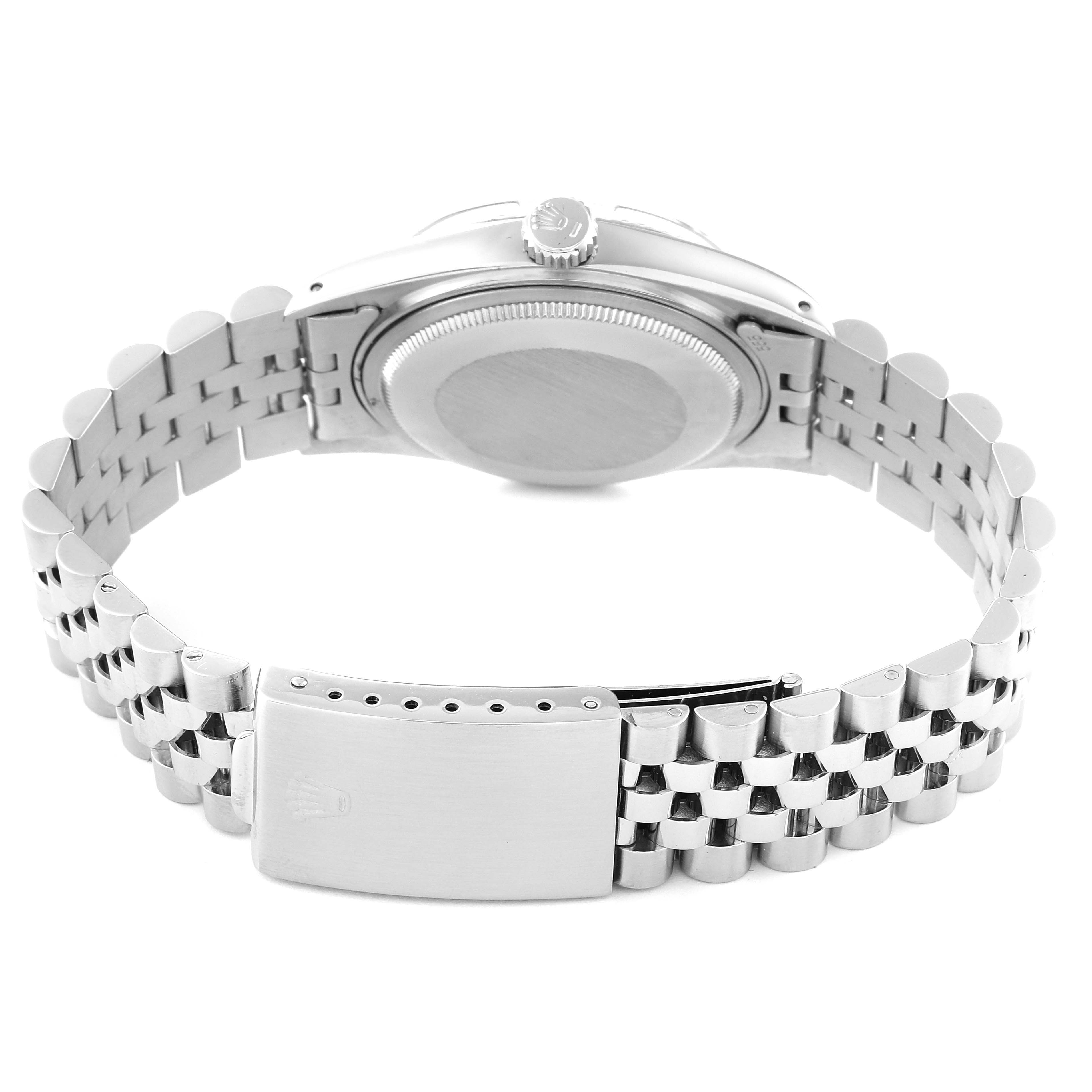 The image shows the back view of a Rolex Vintage Collection 16014 Men's Stainless Steel Silver Dial 16014 Men's Stainless Steel Silver Dial watch, highlighting its case back and metal bracelet with deployment clasp.