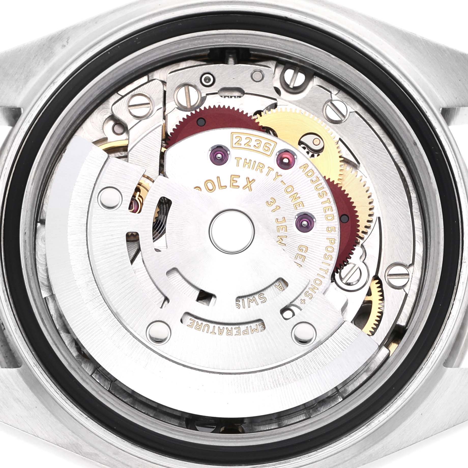 The image shows the movement mechanism of a Rolex Datejust 279384RBR Women
s Stainless Steel Grey Dial 279384RBR Women
s Stainless Steel Grey Dial watch from a rear angle.