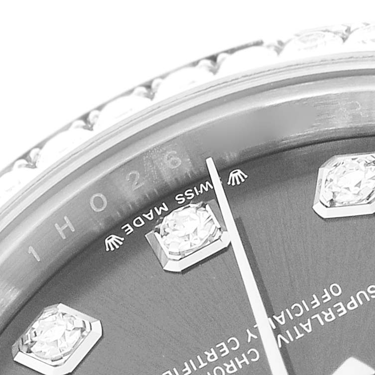 The image shows a close-up angle of a Rolex Datejust 279384RBR Women
s Stainless Steel Grey Dial 279384RBR Women
s Stainless Steel Grey Dial watch face, highlighting diamond hour markers and the bottom of the bezel.