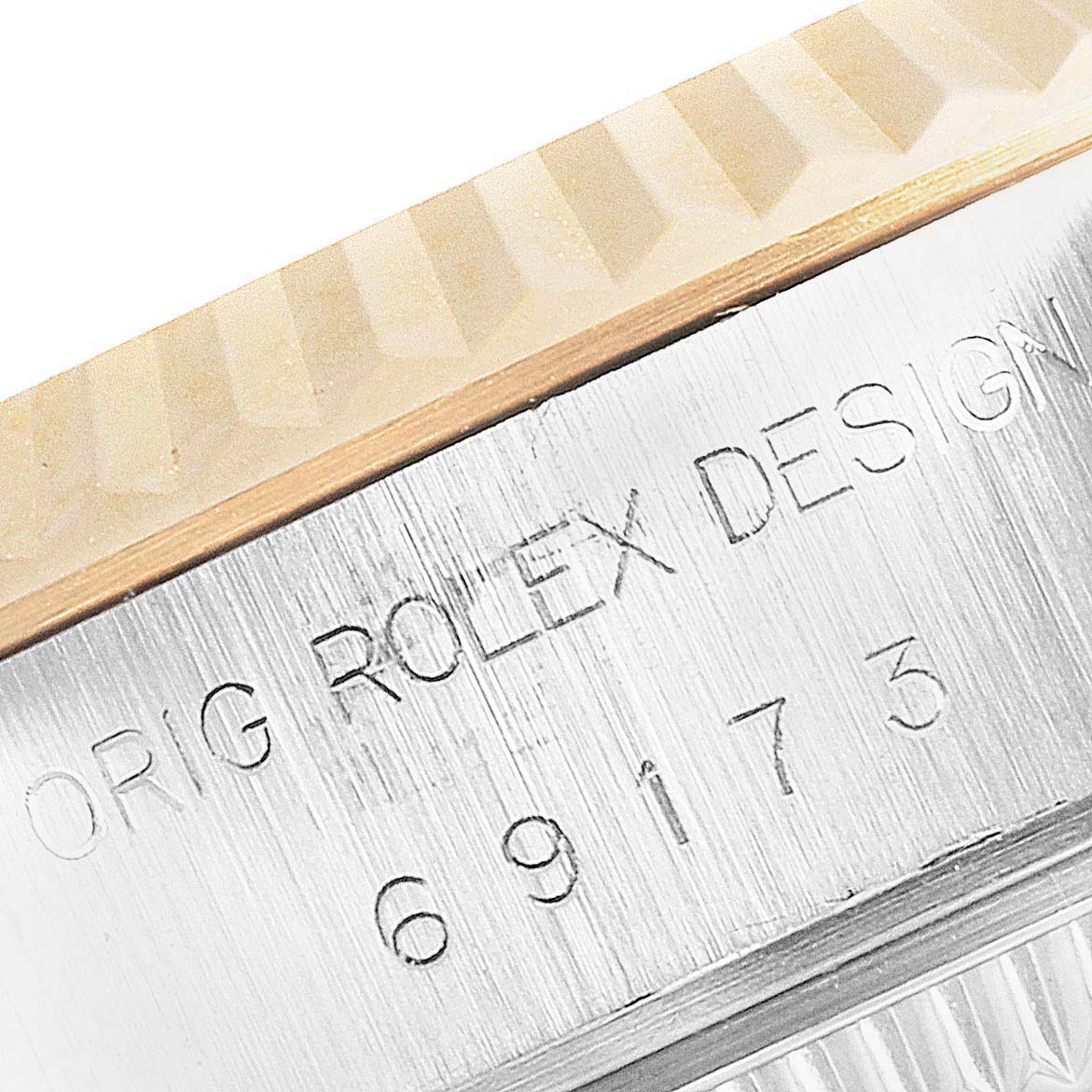This image shows a close-up of the case engraving on a Rolex Datejust 69173 Women
s Steel and Gold (two tone) Silver Dial 69173 Women
s Steel and Gold (two tone) Silver Dial watch.
