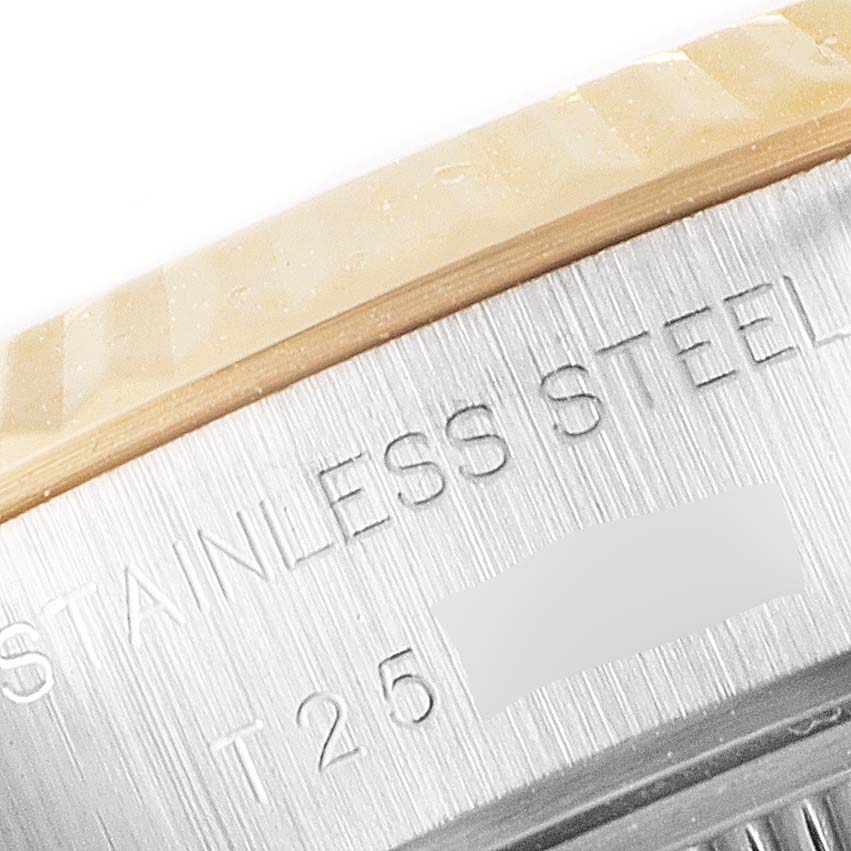 This close-up shows the side engraving and part of the bezel of the Rolex Datejust 69173 Women
s Steel and Gold (two tone) Silver Dial 69173 Women
s Steel and Gold (two tone) Silver Dial watch, highlighting the "STAINLESS STEEL" marking.