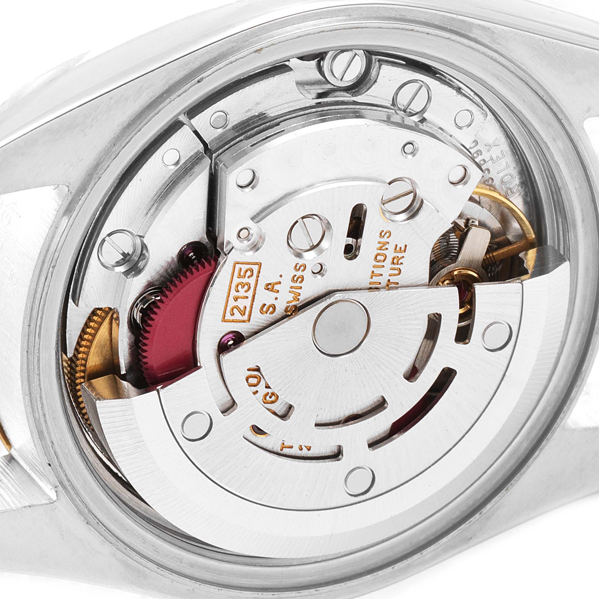 The image shows a close-up of the Rolex Datejust 69173 Women
s Steel and Gold (two tone) Silver Dial 69173 Women
s Steel and Gold (two tone) Silver Dial model
s internal movement mechanism from the back.