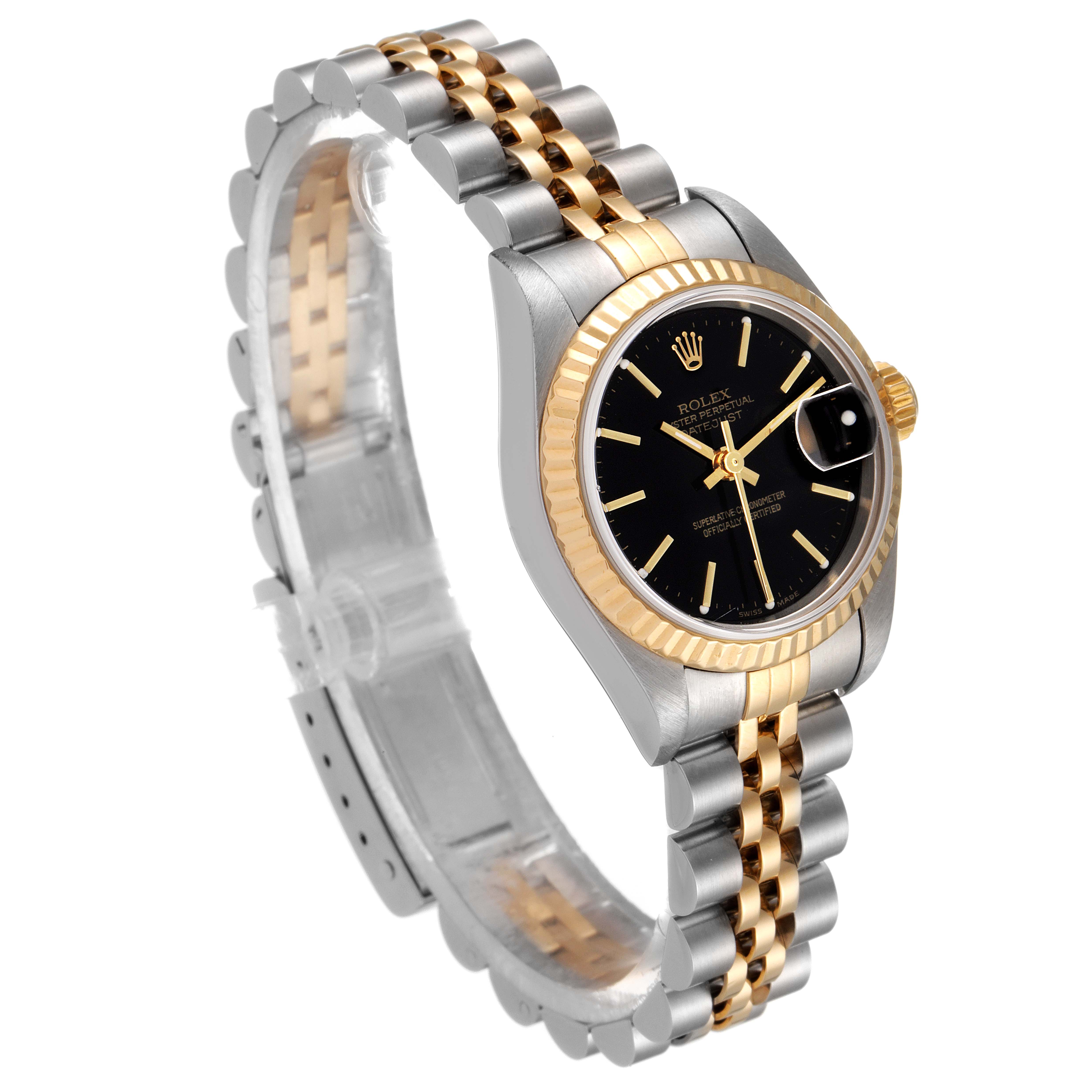 The image shows a Rolex Datejust 79173 Women
s Steel and Gold (two tone) Black Dial 79173 Women
s Steel and Gold (two tone) Black Dial watch at a slight angle, highlighting its black dial, gold fluted bezel, and two-tone bracelet.