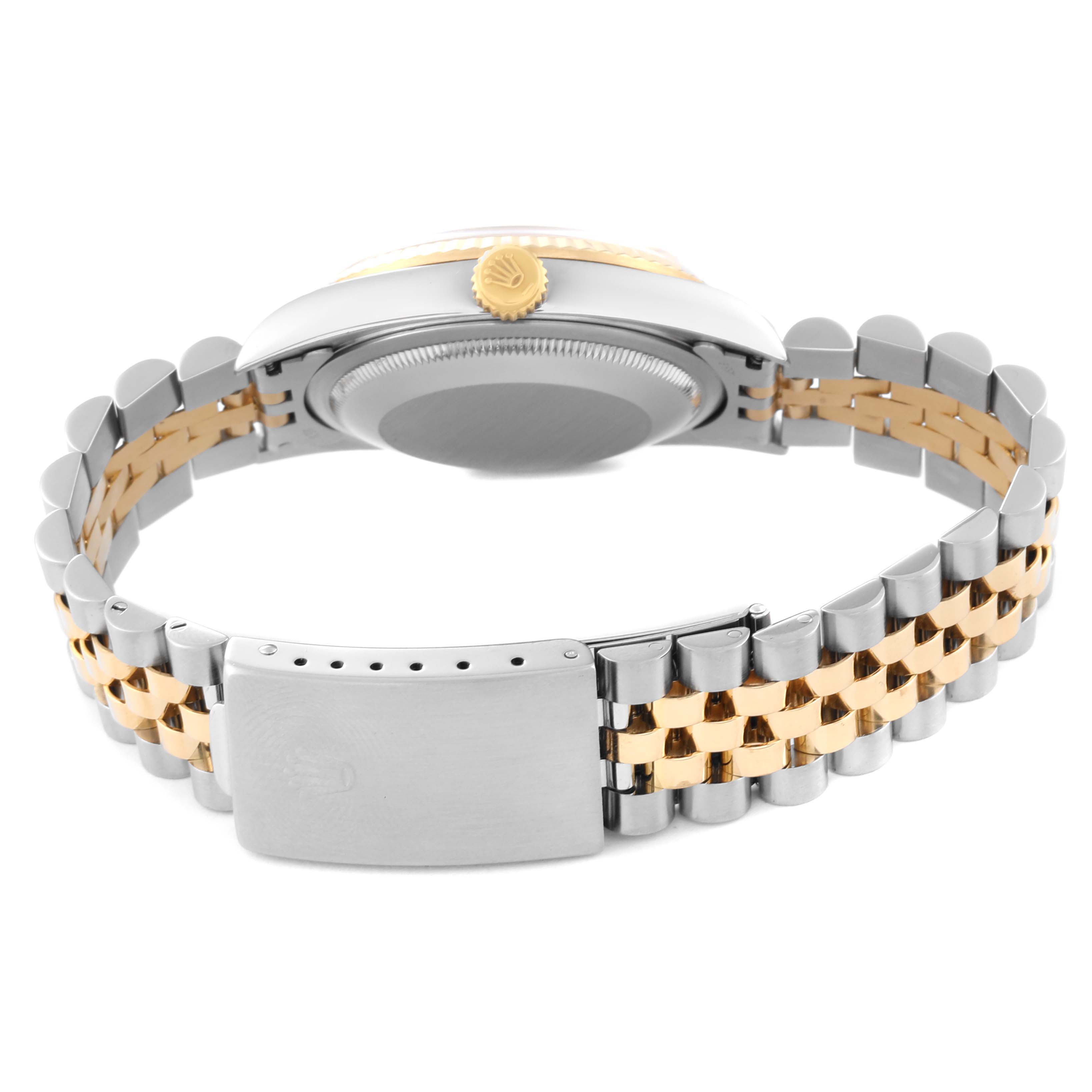 The image shows the back case and bracelet clasp of a Rolex Datejust 16233 Men's Steel and Gold (two tone) Champagne Dial 16233 Men's Steel and Gold (two tone) Champagne Dial watch at a low angle.