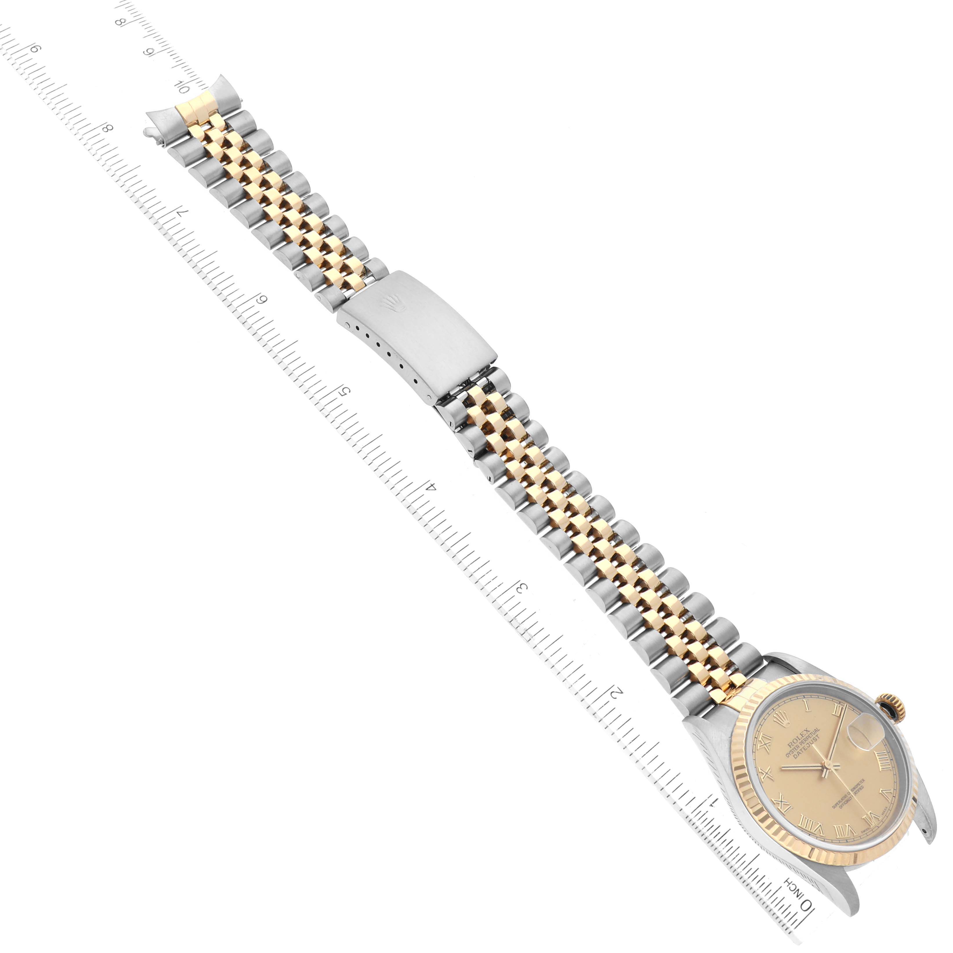 This image shows a Rolex Datejust 16233 Men's Steel and Gold (two tone) Champagne Dial 16233 Men's Steel and Gold (two tone) Champagne Dial watch laid flat, showcasing its dial, case, and two-tone Jubilee bracelet.