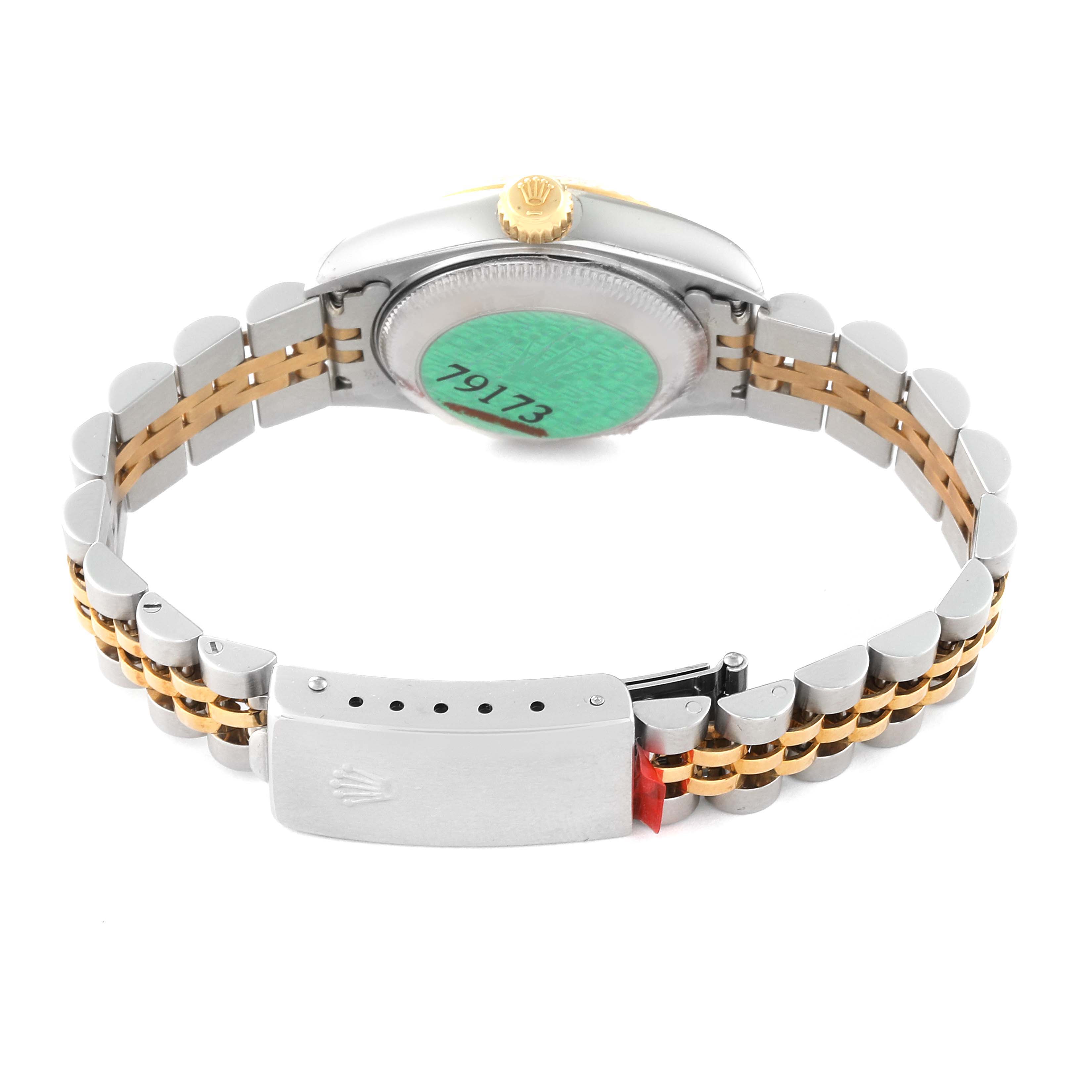 This image shows the backside of the Rolex Datejust 79173G Women's Steel and Gold (two tone) Champagne Dial 79173G Women's Steel and Gold (two tone) Champagne Dial watch, displaying its bracelet, clasp, and case back.