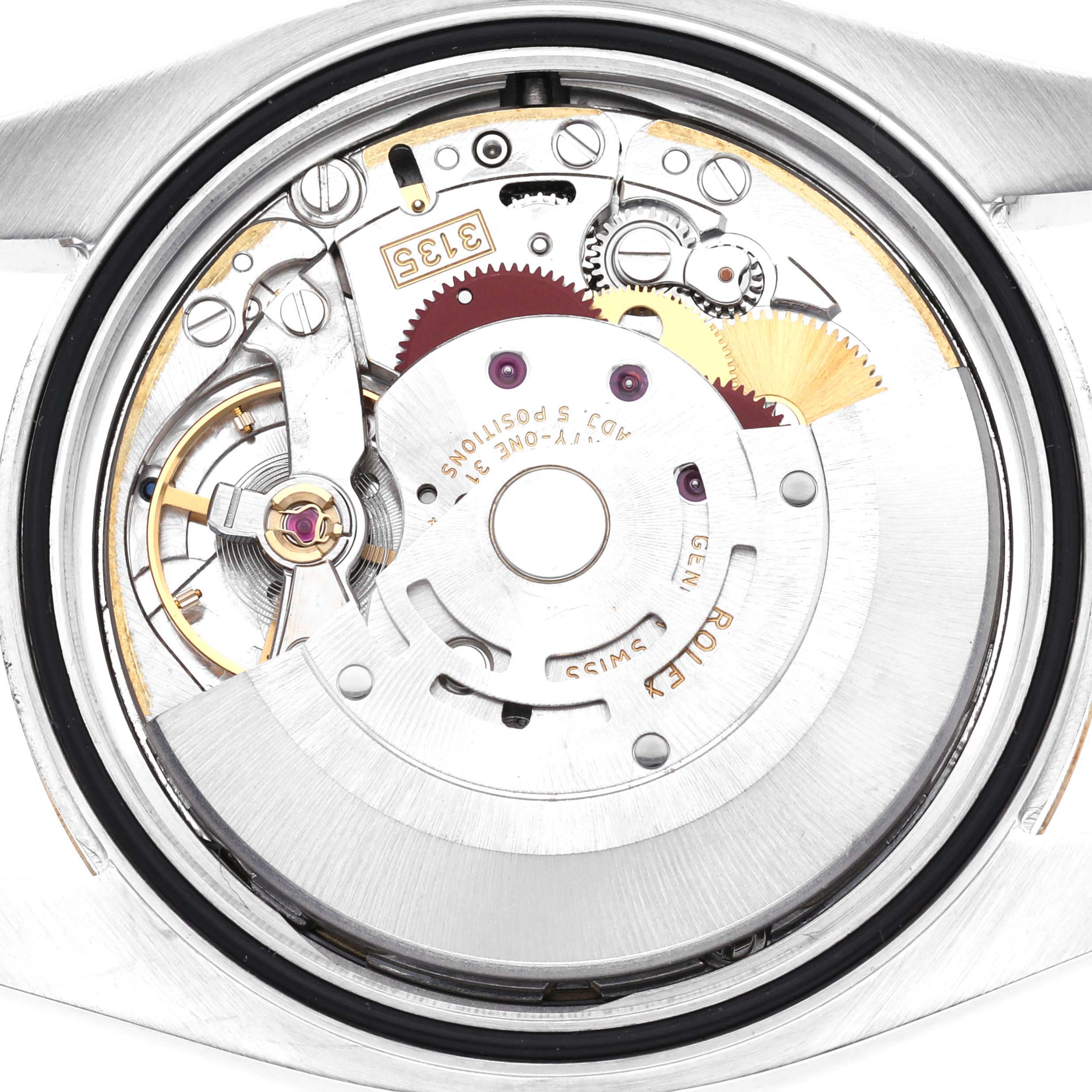 The image shows the movement mechanism of a Rolex Datejust 116233 Men
s Steel and Gold (two tone) Champagne Dial 116233 Men
s Steel and Gold (two tone) Champagne Dial watch with a view of gears and components from the back.