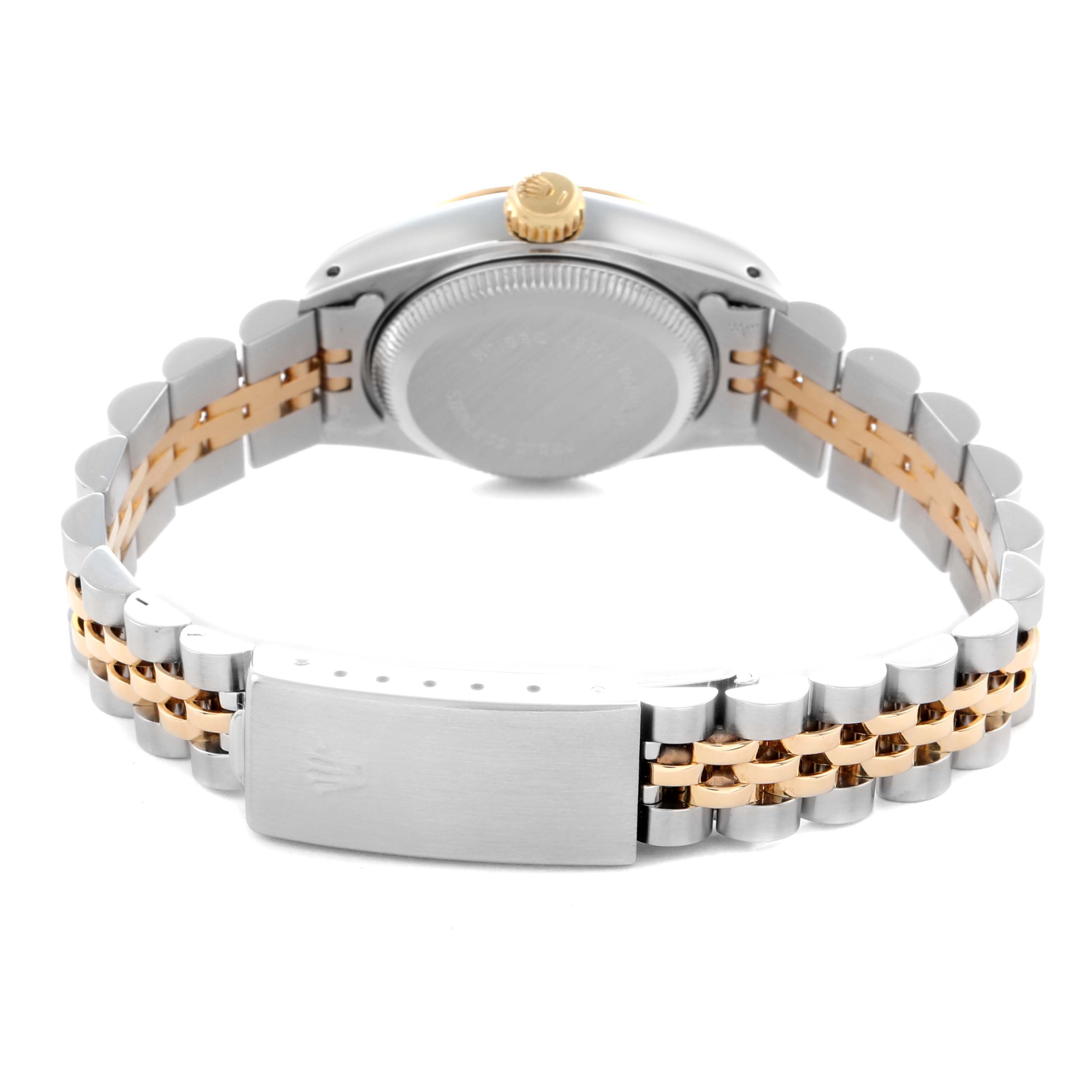 The image shows the back of the Rolex Datejust 69173 Women
s Steel and Gold (two tone) Champagne Dial 69173 Women
s Steel and Gold (two tone) Champagne Dial, focusing on the clasp, bracelet, and case back.