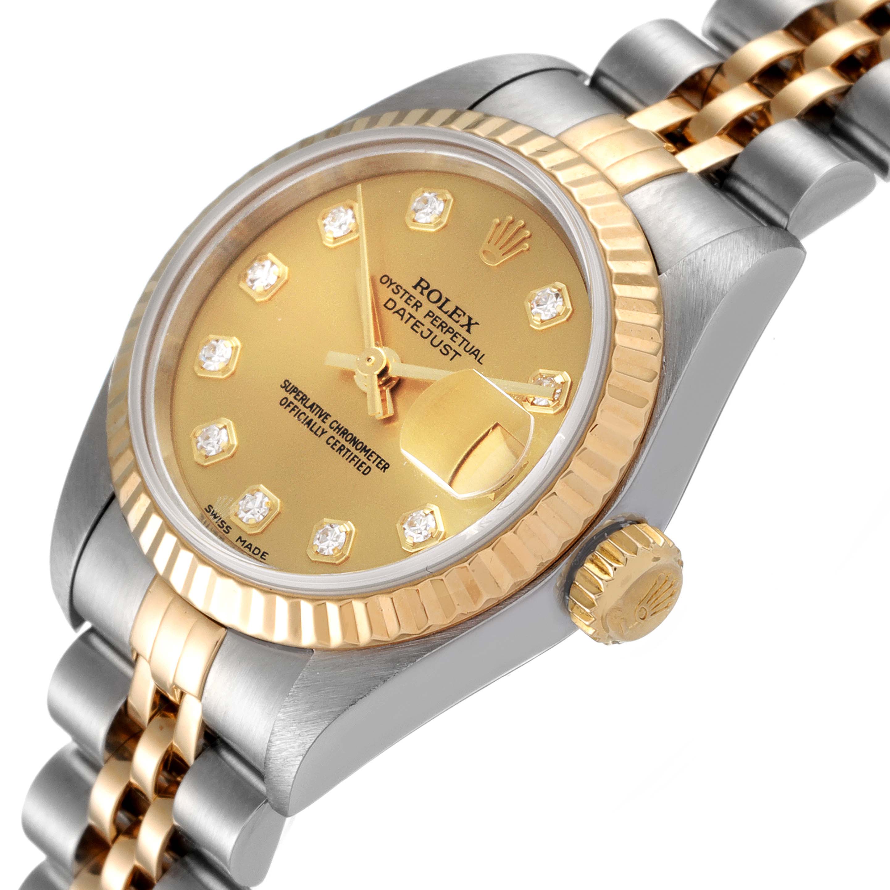 The Rolex Datejust 79173 Women
s Steel and Gold (two tone) Champagne Dial 79173 Women
s Steel and Gold (two tone) Champagne Dial watch is shown at a slight angle, highlighting its gold dial, jubilee bracelet, fluted bezel, and crown.