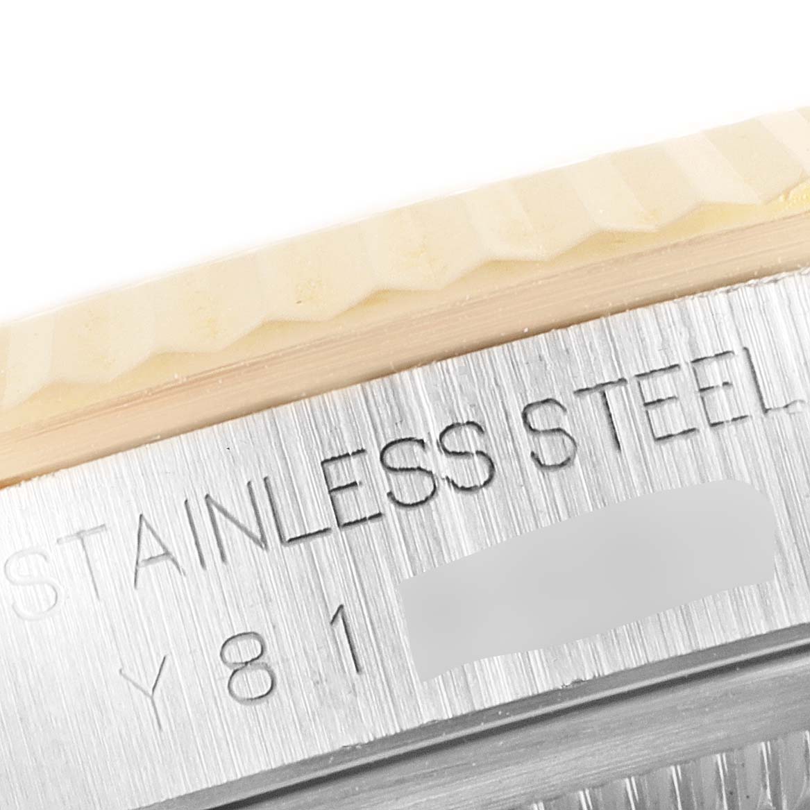 This image shows a close-up angle of the brushed stainless steel case side and part of the fluted bezel of a Rolex Datejust 16233 Men's Steel and Gold (two tone) Champagne Dial 16233 Men's Steel and Gold (two tone) Champagne Dial watch.