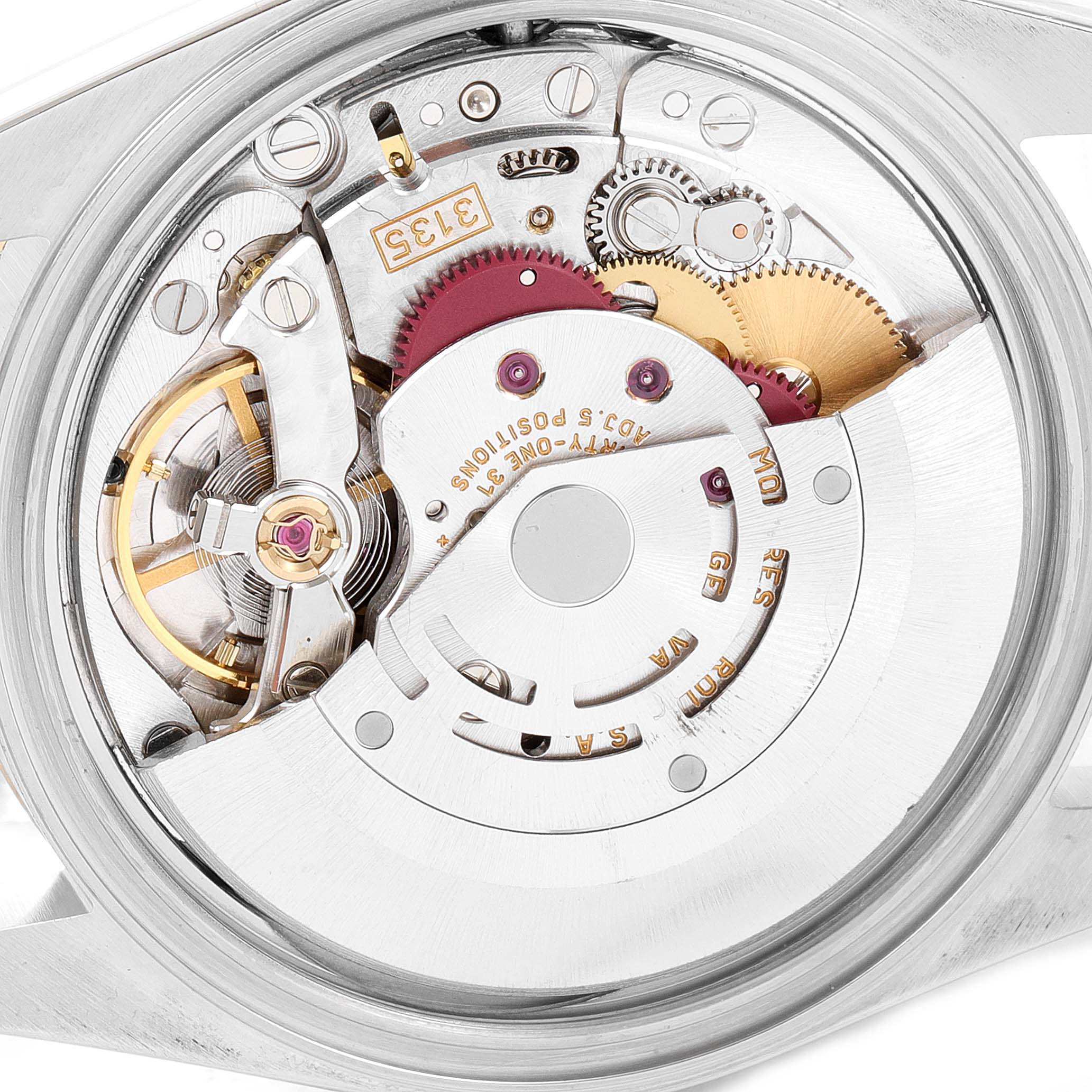 This image shows a close-up of the Rolex Datejust 16233 Men's Steel and Gold (two tone) Champagne Dial 16233 Men's Steel and Gold (two tone) Champagne Dial watch's internal movement mechanism.