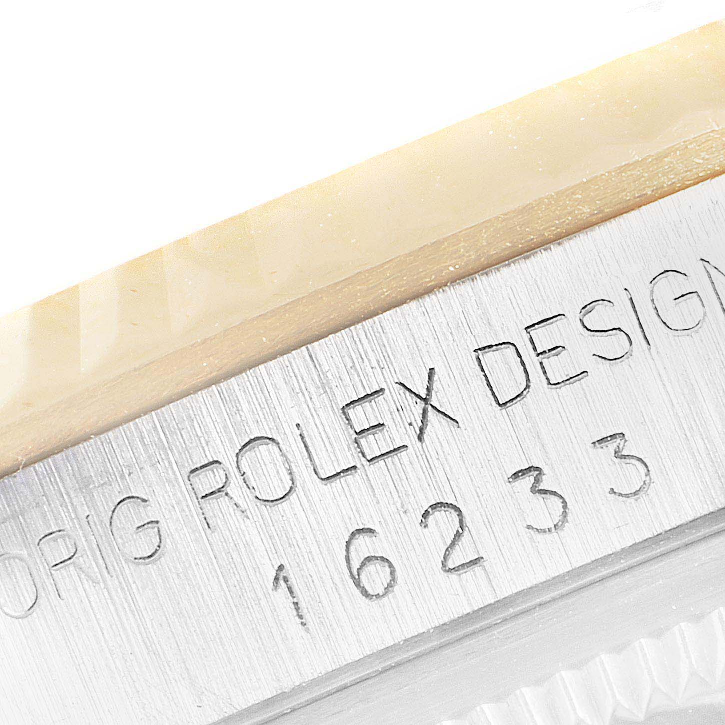 This image shows a close-up of the case side engraving on a Rolex Datejust 16233 Men's Steel and Gold (two tone) Champagne Dial 16233 Men's Steel and Gold (two tone) Champagne Dial model, featuring its model number and "Rolex Design" text.