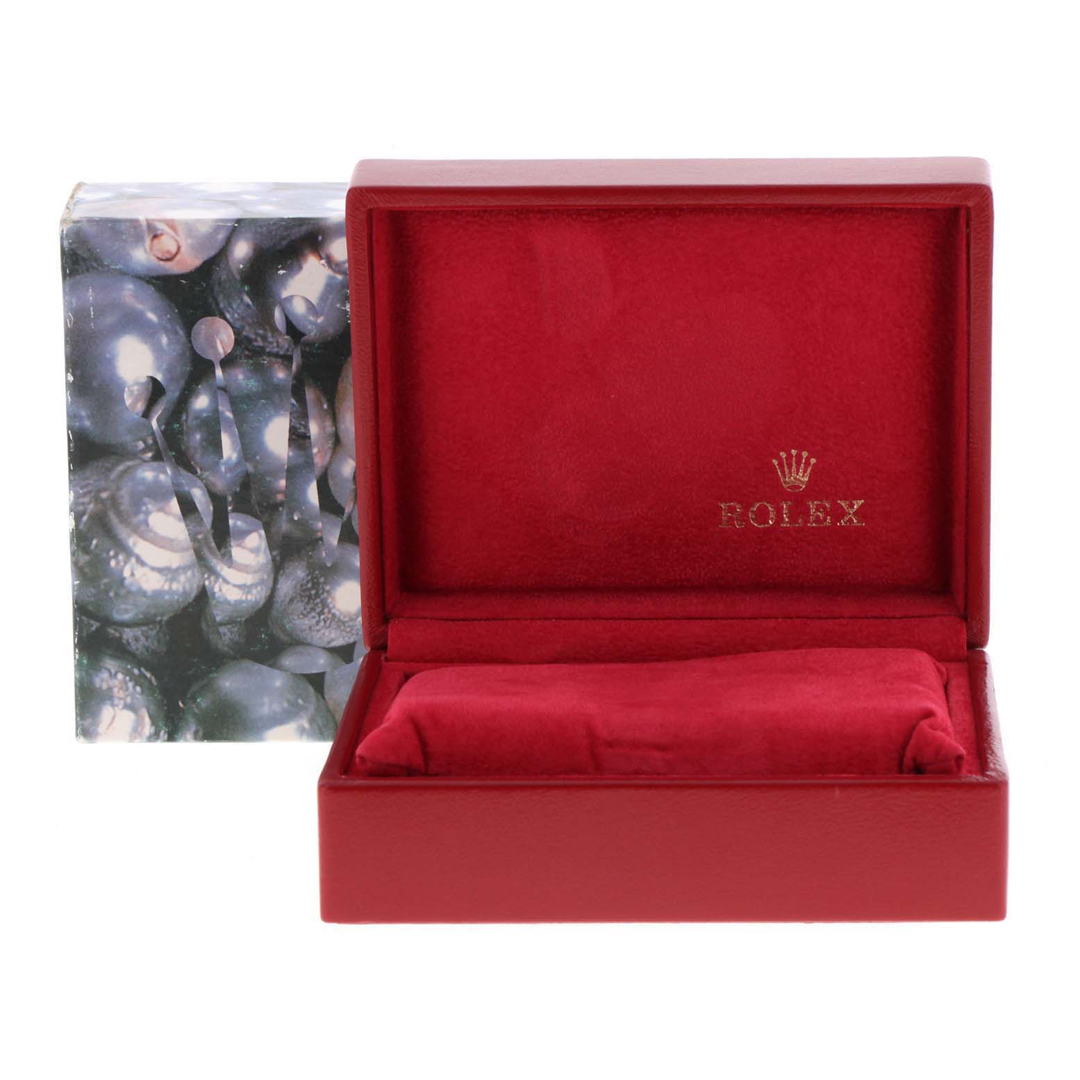 The image shows an empty red Rolex Datejust 79173 Women's Steel and Gold (two tone) Mother of Pearl Dial 79173 Women's Steel and Gold (two tone) Mother of Pearl Dial watch box with a pillow inside, viewed from the front.
