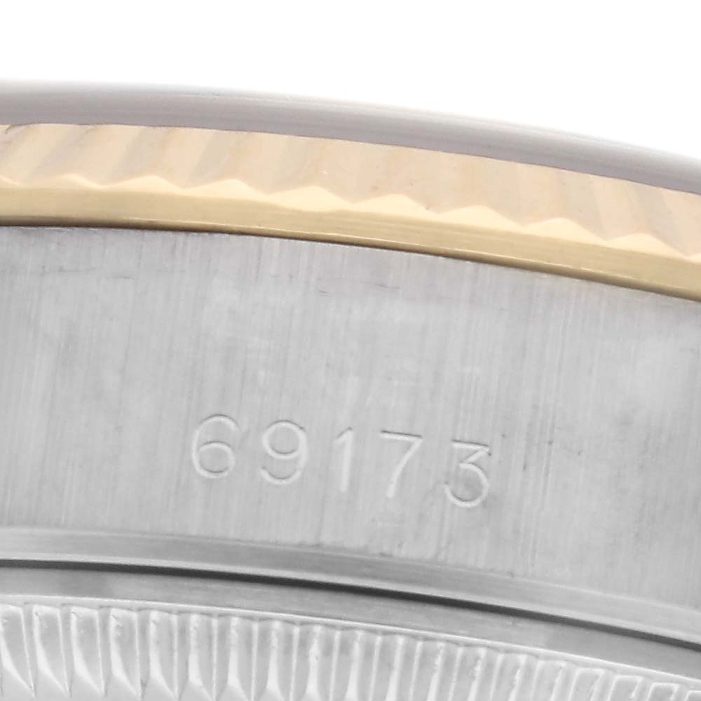 The image shows a close-up of the side of a Rolex Datejust 69173 Women
s Steel and Gold (two tone) Grey Dial 69173 Women
s Steel and Gold (two tone) Grey Dial, highlighting the model number engraving.