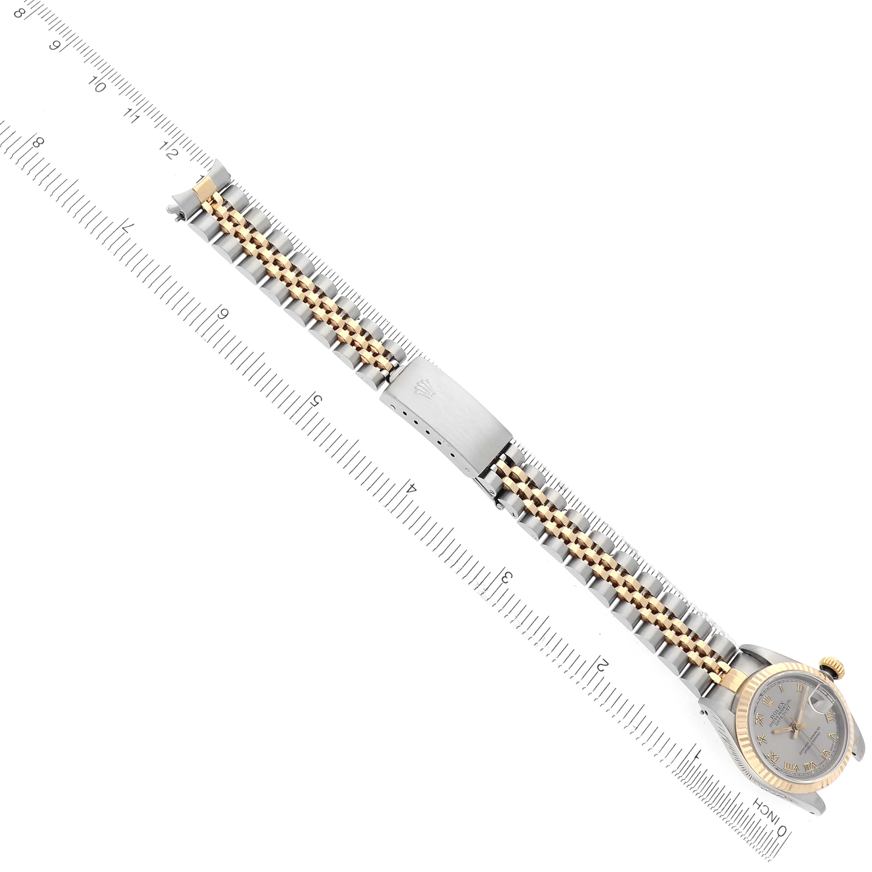 The image shows a Rolex Datejust 69173 Women
s Steel and Gold (two tone) Grey Dial 69173 Women
s Steel and Gold (two tone) Grey Dial watch from an overhead angle, displaying the full bracelet and part of the watch face.