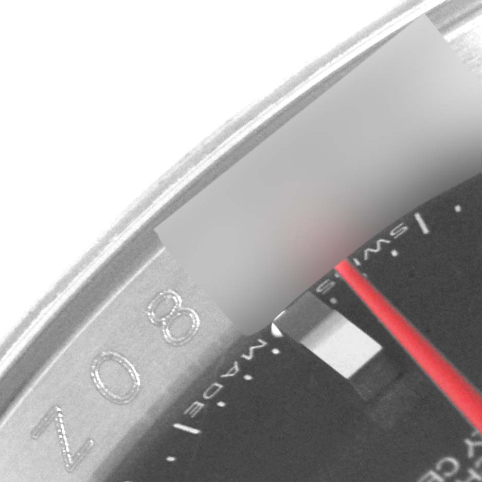 This close-up shot of the Rolex Turn-o-Graph 116264 Men's Stainless Steel Black Dial 116264 Men's Stainless Steel Black Dial watch shows part of the bezel and the dial with a red seconds hand.