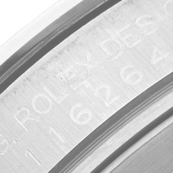 This close-up image shows the engraved serial number and brand information on the side of the Rolex Turn-o-Graph 116264 Men's Stainless Steel Black Dial 116264 Men's Stainless Steel Black Dial watch casing.