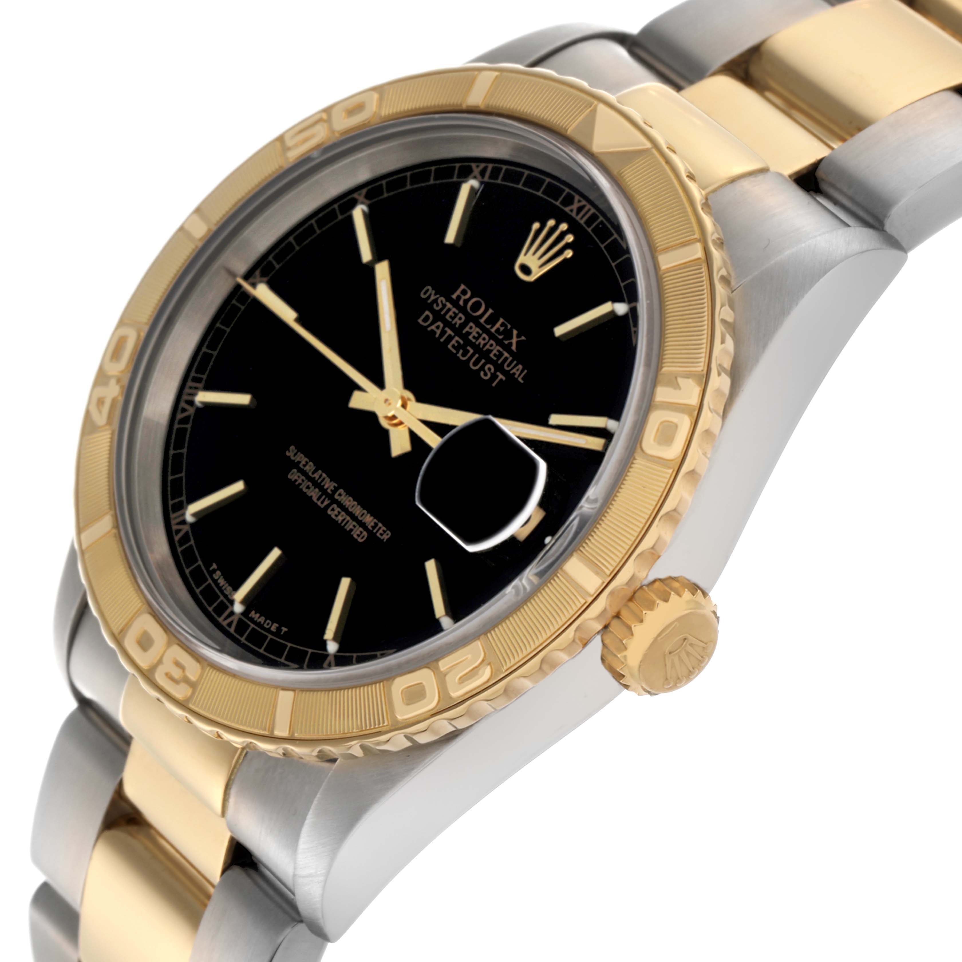 The Rolex Turn-o-Graph 16263 Men
s Steel and Gold (two tone) Black Dial 16263 Men
s Steel and Gold (two tone) Black Dial watch is shown at a three-quarter angle, highlighting its gold bezel, black dial, and two-tone bracelet.