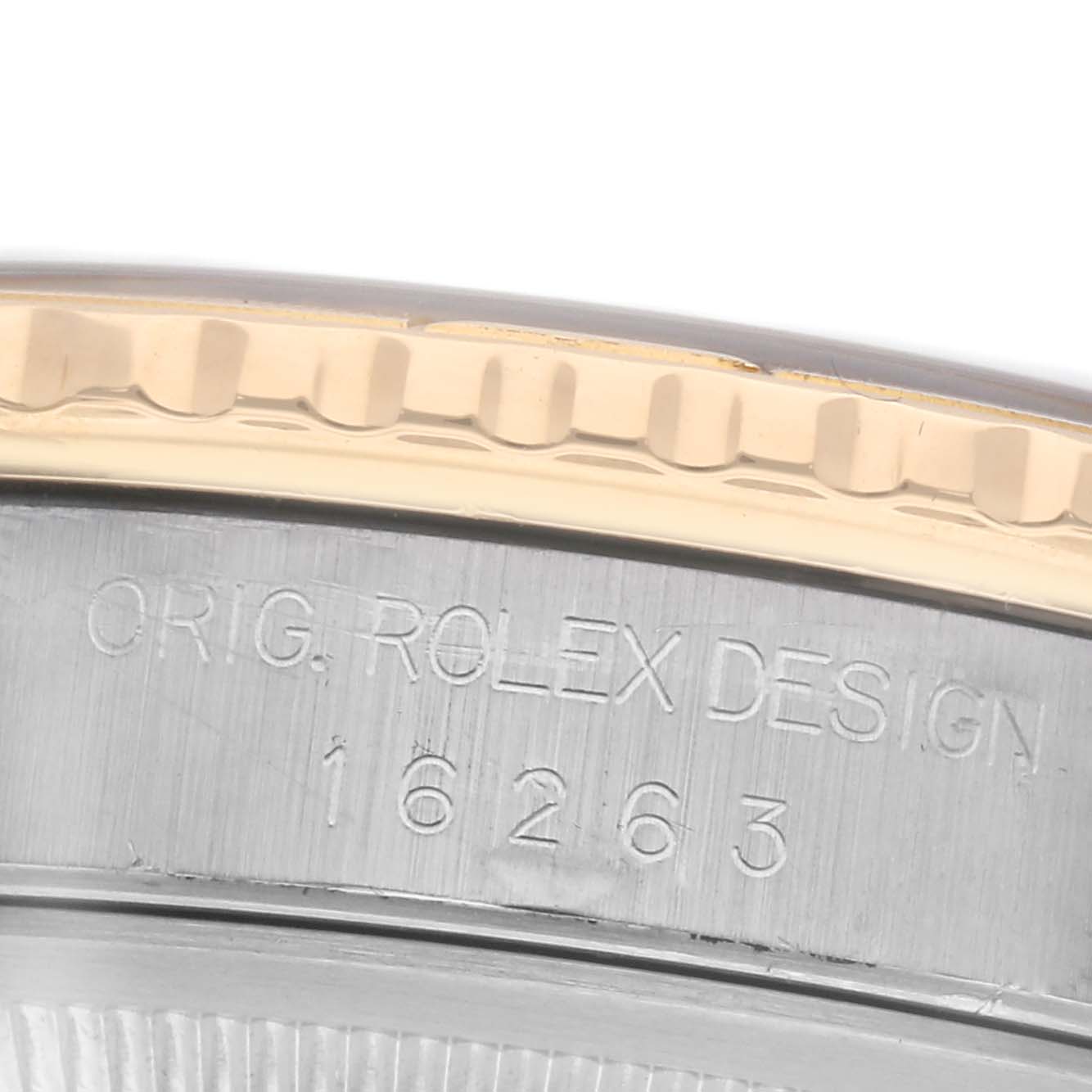 The image shows a close-up of the engravings on the side of a Rolex Turn-o-Graph 16263 Men
s Steel and Gold (two tone) Black Dial 16263 Men
s Steel and Gold (two tone) Black Dial, including "ORIG. ROLEX DESIGN" and model number 16263.