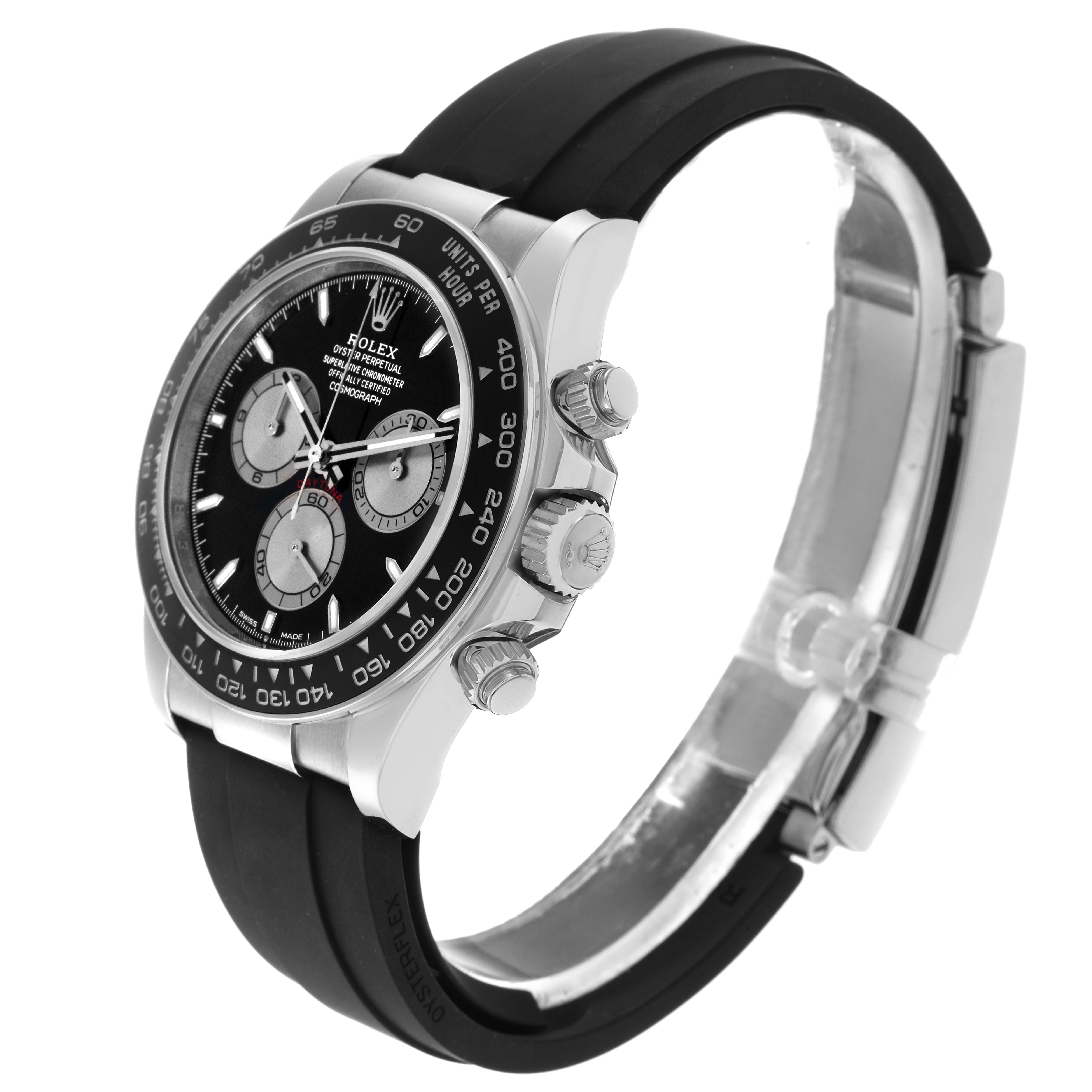 The Rolex Daytona 126519 Men
s White Gold Black Dial 126519 Men
s White Gold Black Dial watch is shown from a side angle, highlighting the crown, pushers, bezel, and part of the strap.