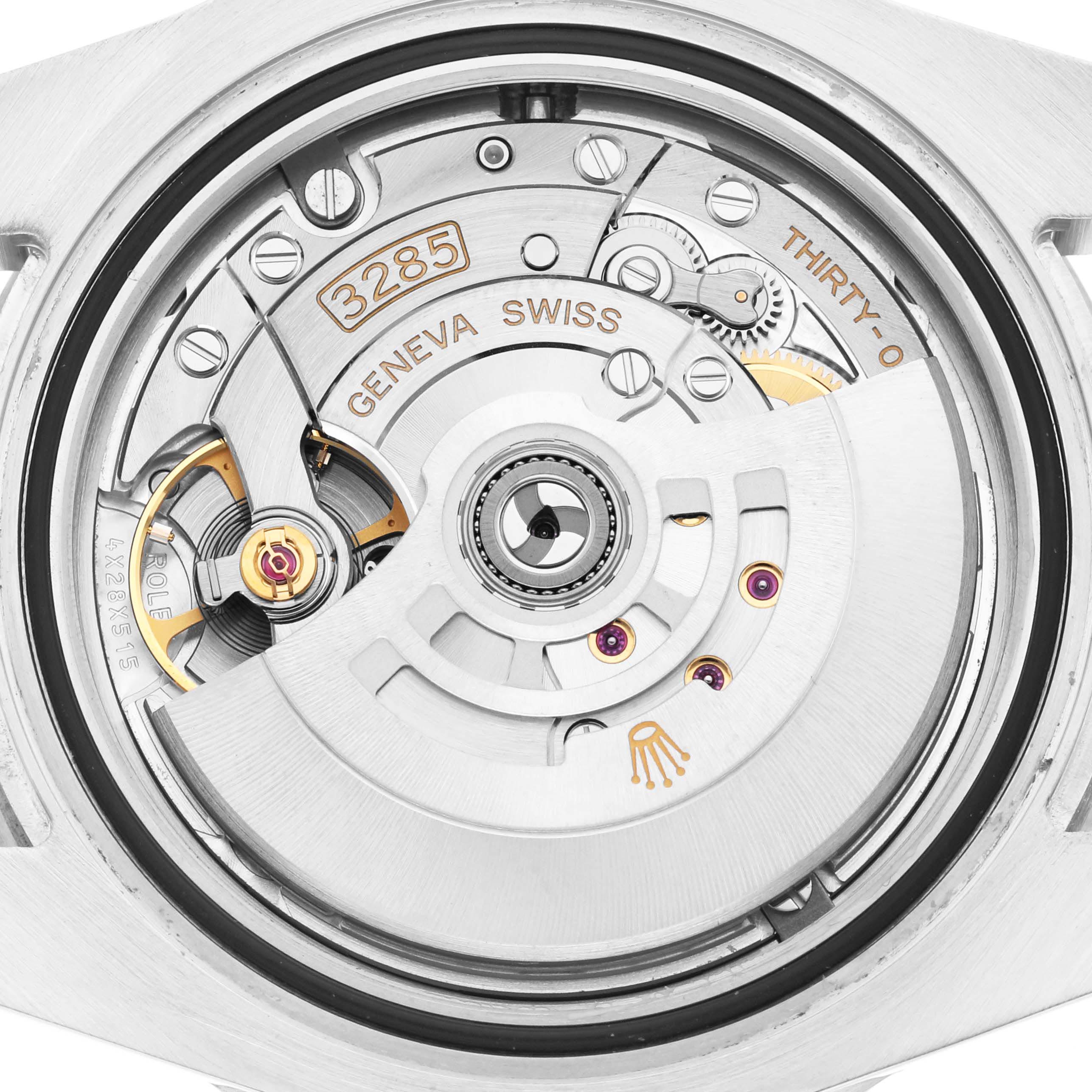 The image shows the movement of a Rolex GMT-Master 126710 Men
s Stainless Steel Black Dial 126710 Men
s Stainless Steel Black Dial watch from a top-down angle, highlighting the intricate mechanics.