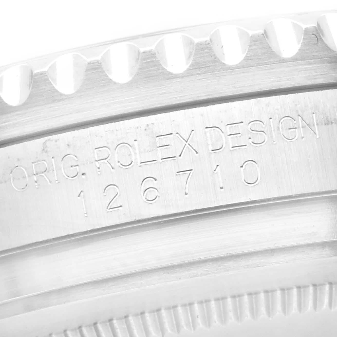 The image shows the engraved side of the Rolex GMT-Master 126710 Men
s Stainless Steel Black Dial 126710 Men
s Stainless Steel Black Dial model, focusing on the case with design markings.