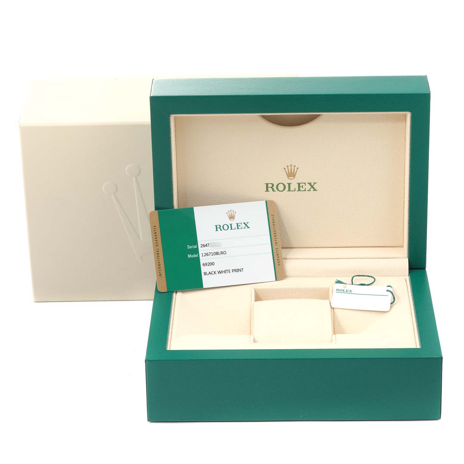 The image shows the packaging for a Rolex GMT-Master 126710 Men's Stainless Steel Black Dial 126710 Men's Stainless Steel Black Dial watch, including the green box and accompanying accessories like a tag and card.