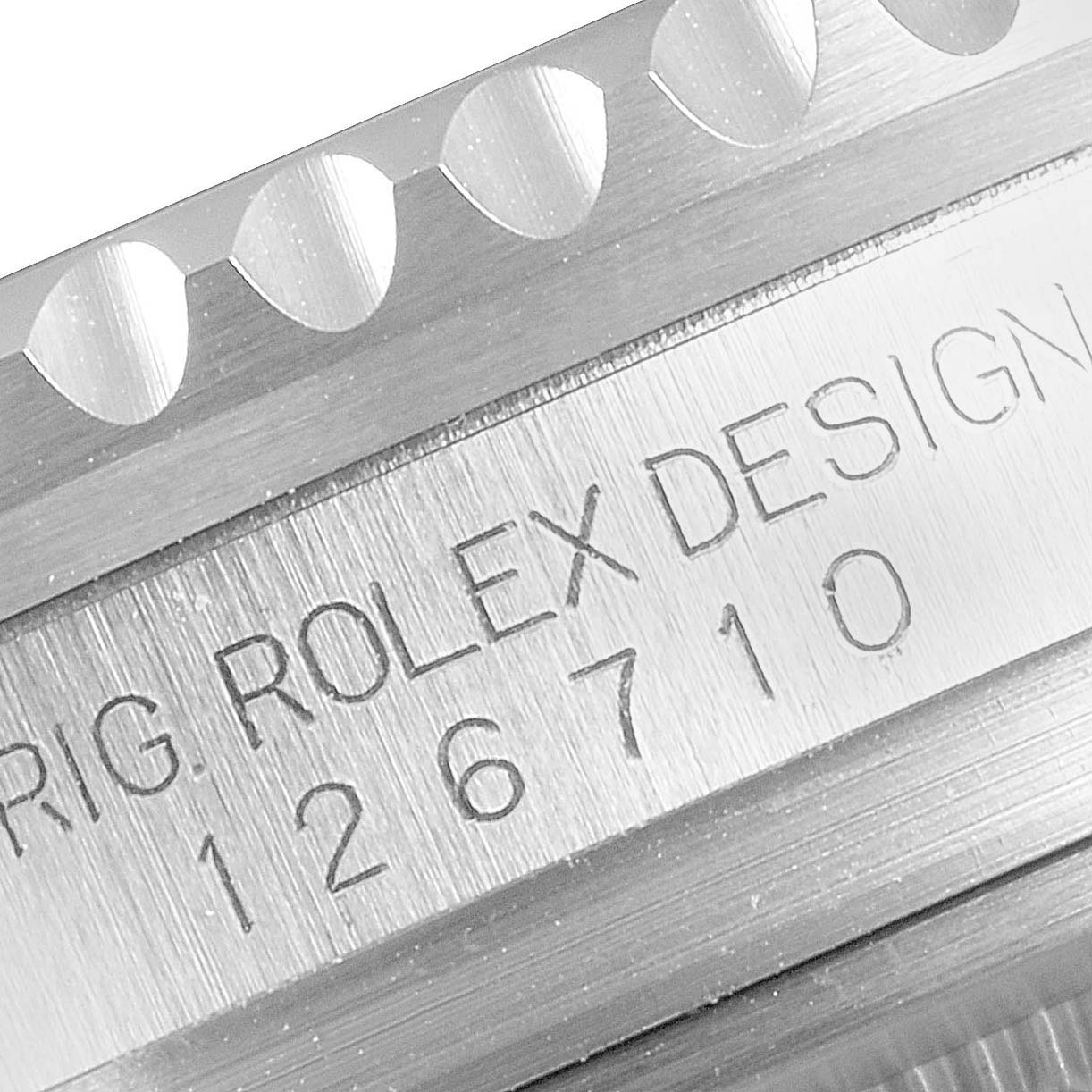 The image shows a close-up of the casing and bezel of the Rolex GMT-Master 126710 Men's Stainless Steel Black Dial 126710 Men's Stainless Steel Black Dial, displaying the model number and brand engraving.