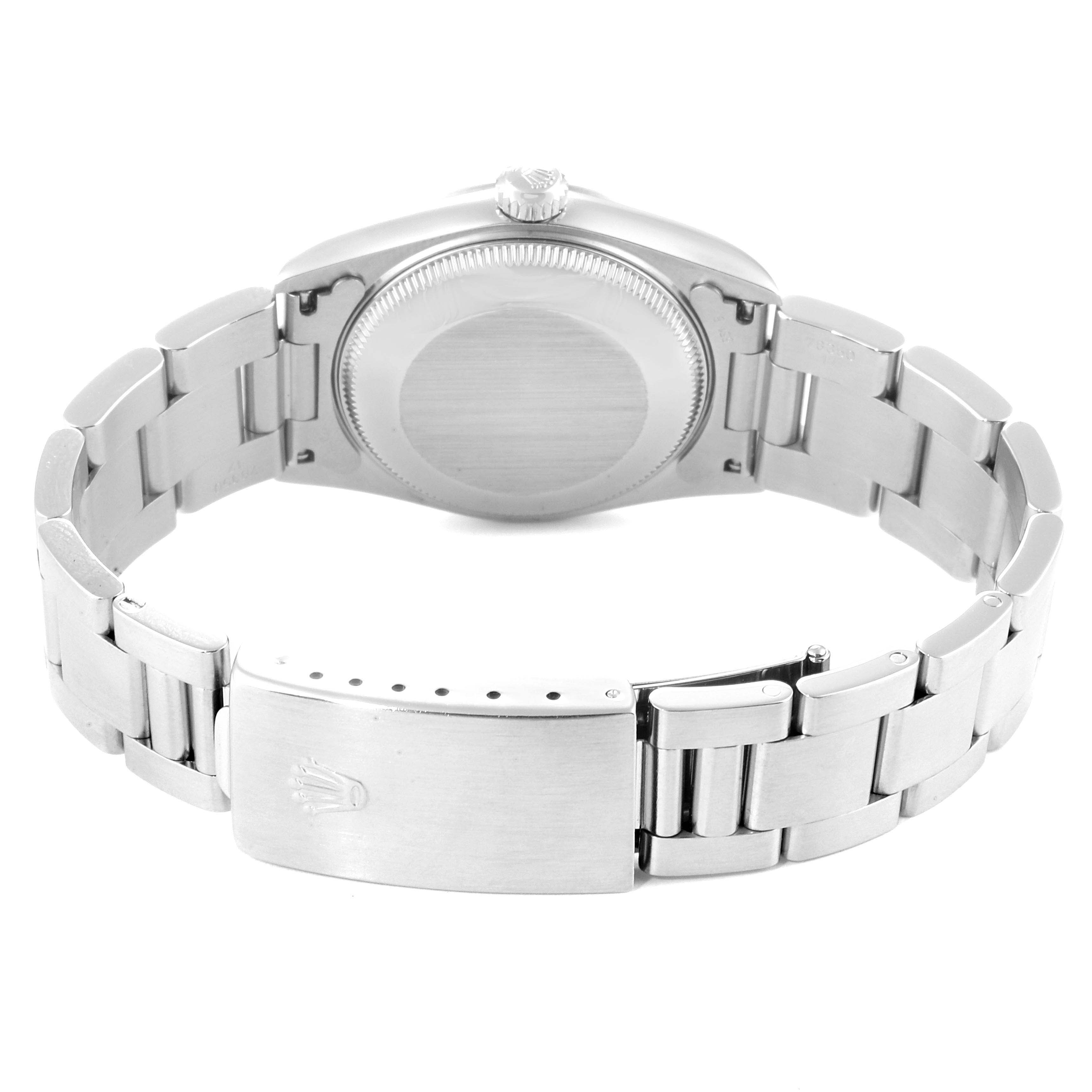 The image shows the backside of a Rolex Mid-Size 67480 Women
s Stainless Steel Blue Dial 67480 Women
s Stainless Steel Blue Dial model watch displaying the clasp and bracelet links.