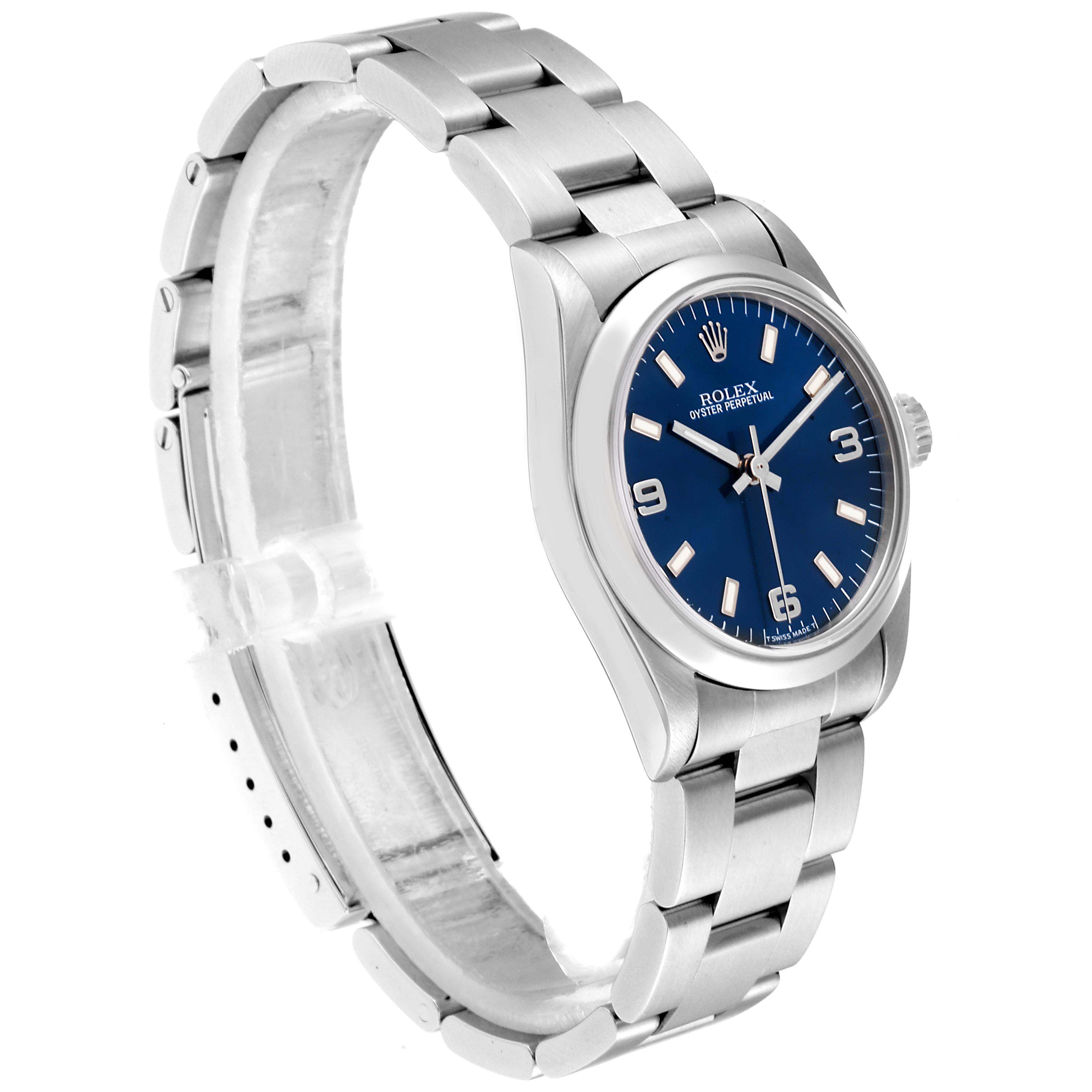This image shows a side and partial front view of a Rolex Mid-Size 67480 Women
s Stainless Steel Blue Dial 67480 Women
s Stainless Steel Blue Dial watch with a blue dial and stainless steel bracelet.