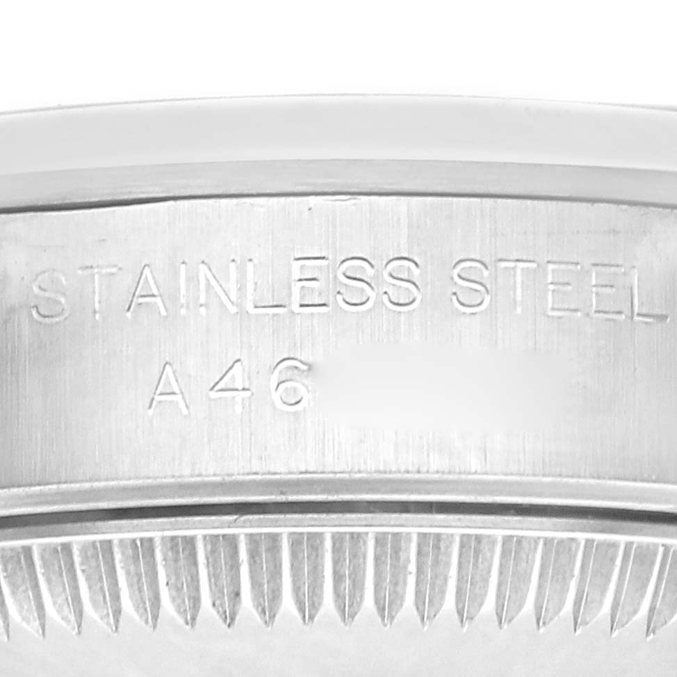 The image shows a close-up of the stainless steel case side with engravings on a Rolex Oyster Perpetual 76080 Women
s Stainless Steel Black Dial 76080 Women
s Stainless Steel Black Dial watch.