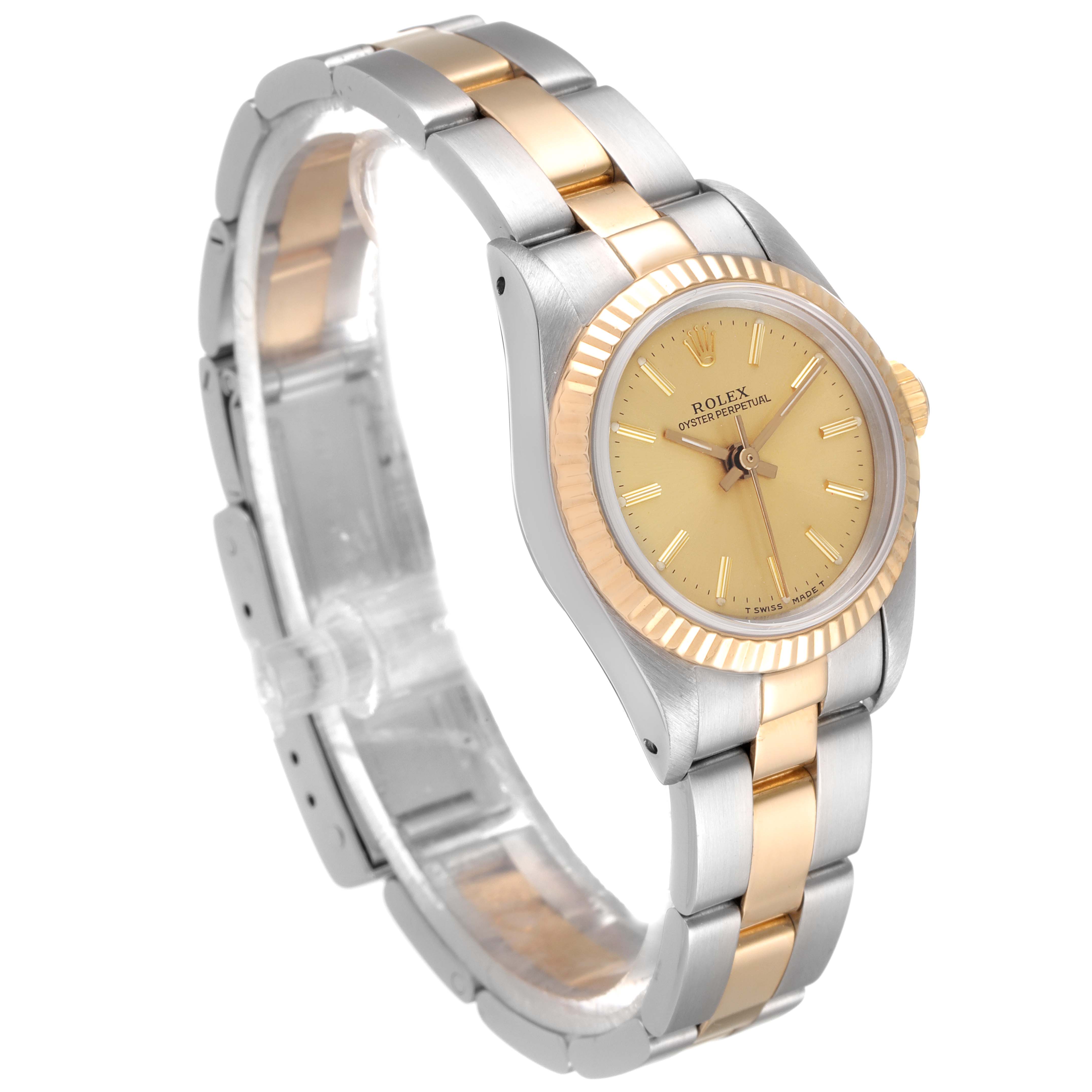 The Rolex Oyster Perpetual 67193 Women
s Steel and Gold (two tone) Champagne Dial 67193 Women
s Steel and Gold (two tone) Champagne Dial watch is shown at a three-quarter angle, displaying the face, bezel, and bracelet.