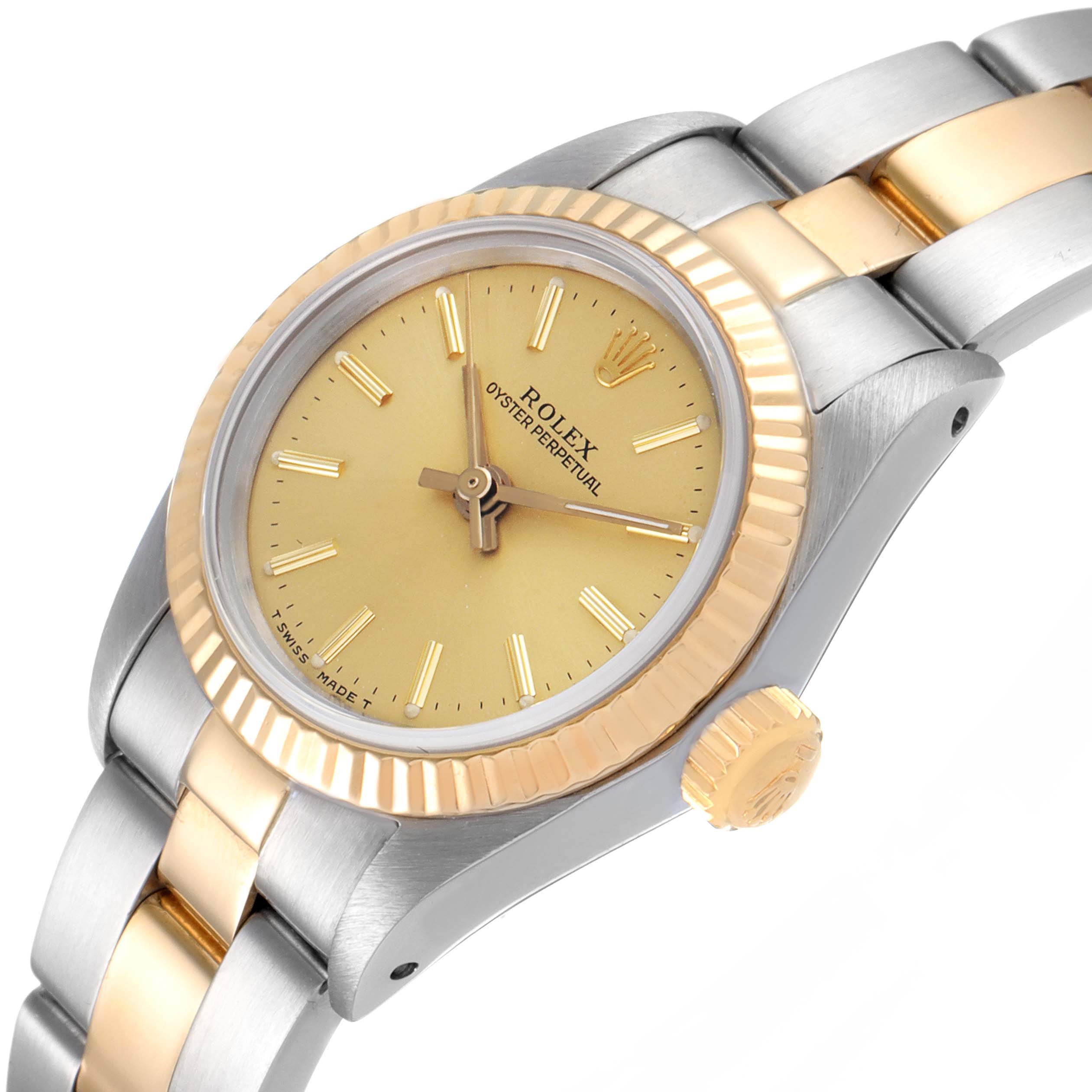 The Rolex Oyster Perpetual 67193 Women
s Steel and Gold (two tone) Champagne Dial 67193 Women
s Steel and Gold (two tone) Champagne Dial is shown at an angled view, highlighting its gold bezel, dial, and part of the two-tone bracelet.