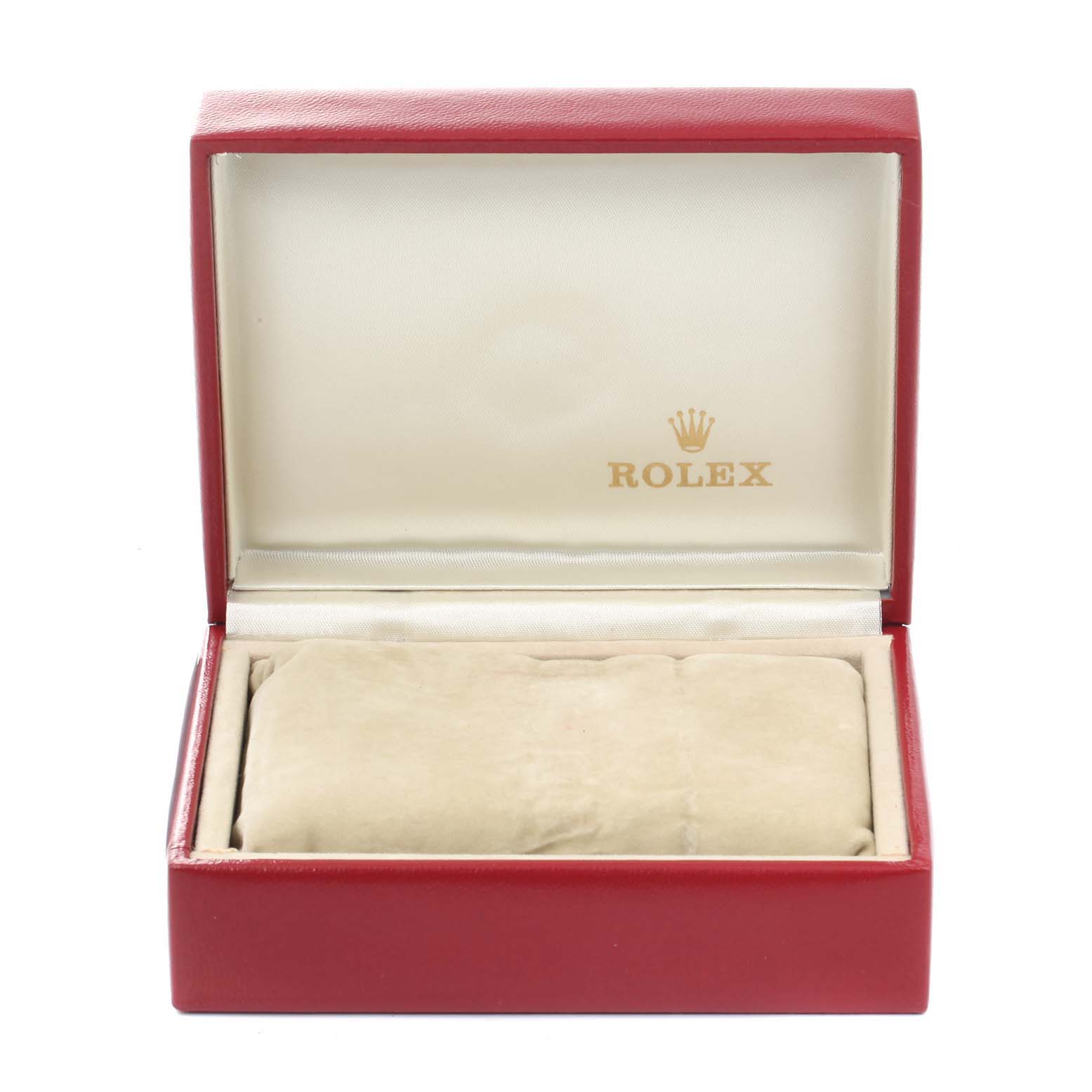 The image depicts an open red Rolex watch box for the Oyster Perpetual model, with a beige cushion inside.