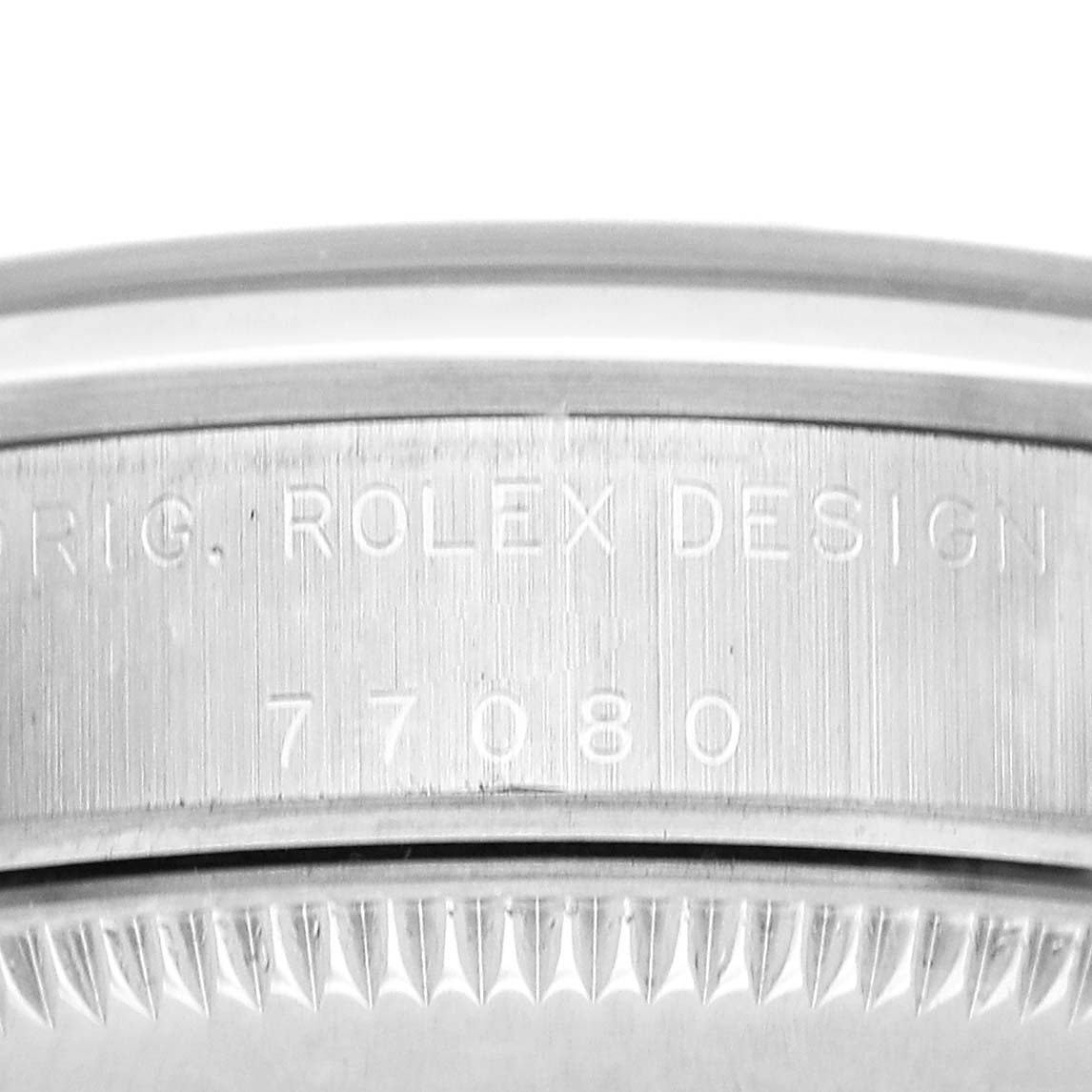 The image shows a close-up of the case side with "ROLEX DESIGN" and model number engraving for a Rolex Mid-Size 77080 Womens Stainless Steel Black Dial watch.