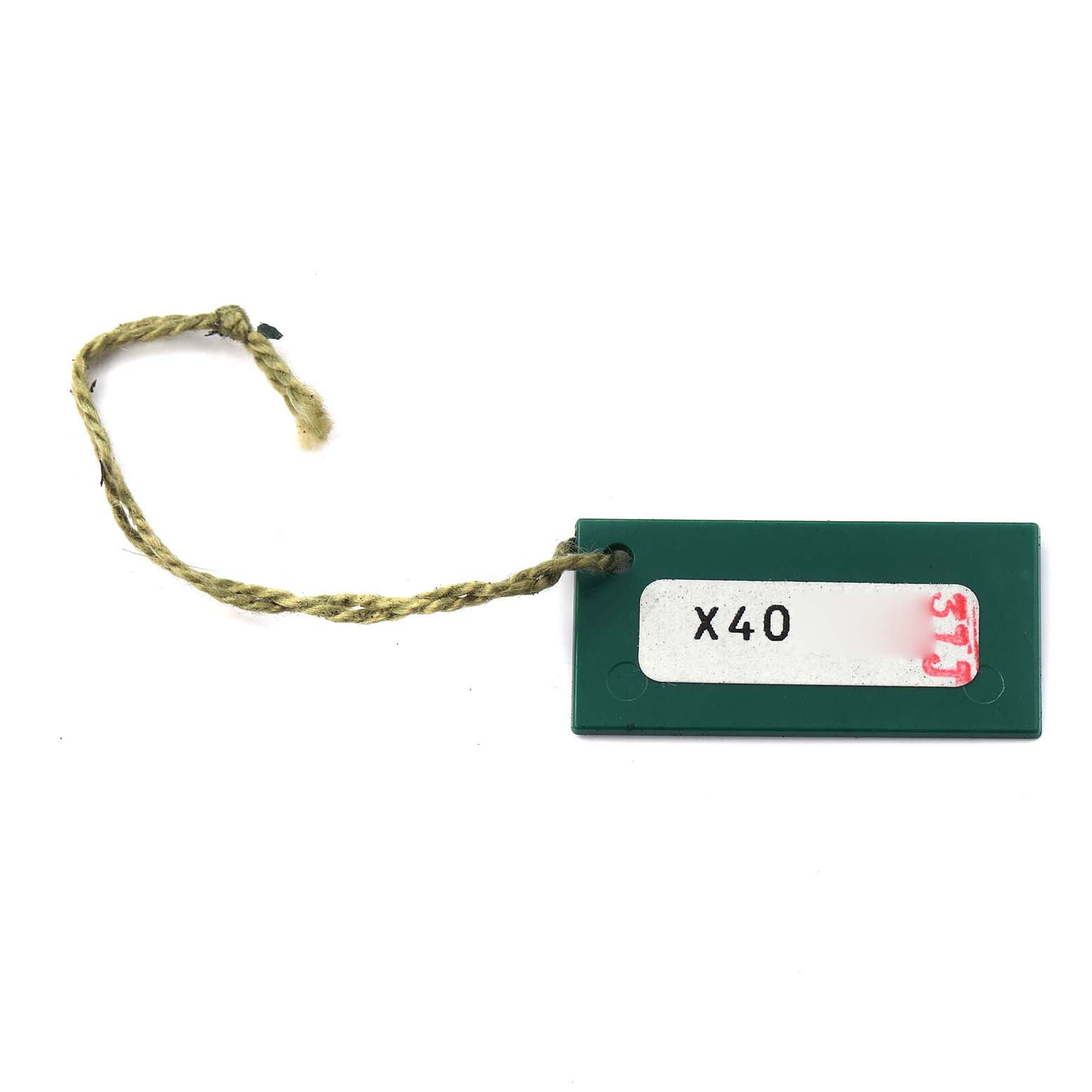 This is a top-down view of a green tag with a string, associated with the Rolex Oyster Perpetual 76080 Women
s Stainless Steel Pink Dial 76080 Women
s Stainless Steel Pink Dial model.