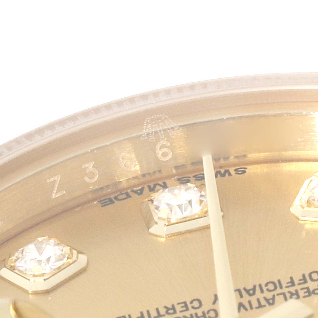 The image shows a close-up of the dial and diamond markers of a Rolex President 179178 Women's Yellow Gold Champagne Dial 179178 Women's Yellow Gold Champagne Dial model watch.