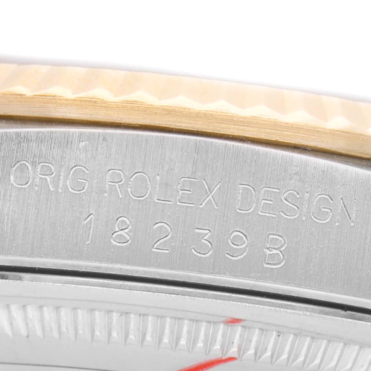 The image shows a close-up view of the edge and side engraving on the Rolex President 18239BIC Men's White Gold Champagne Dial model.