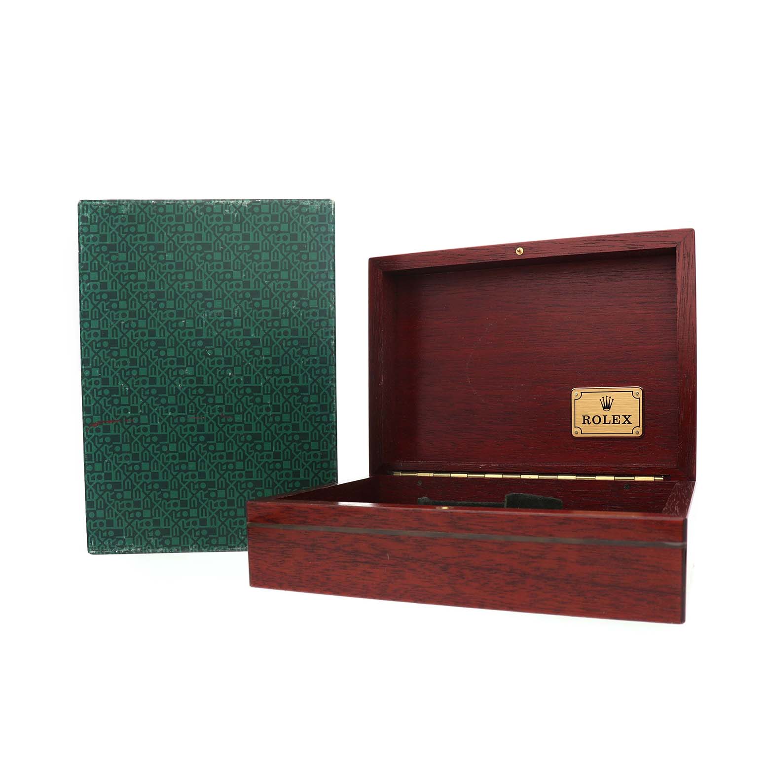 The image shows an open wooden box with a Rolex plaque, likely for the President model, alongside a closed green-patterned box.