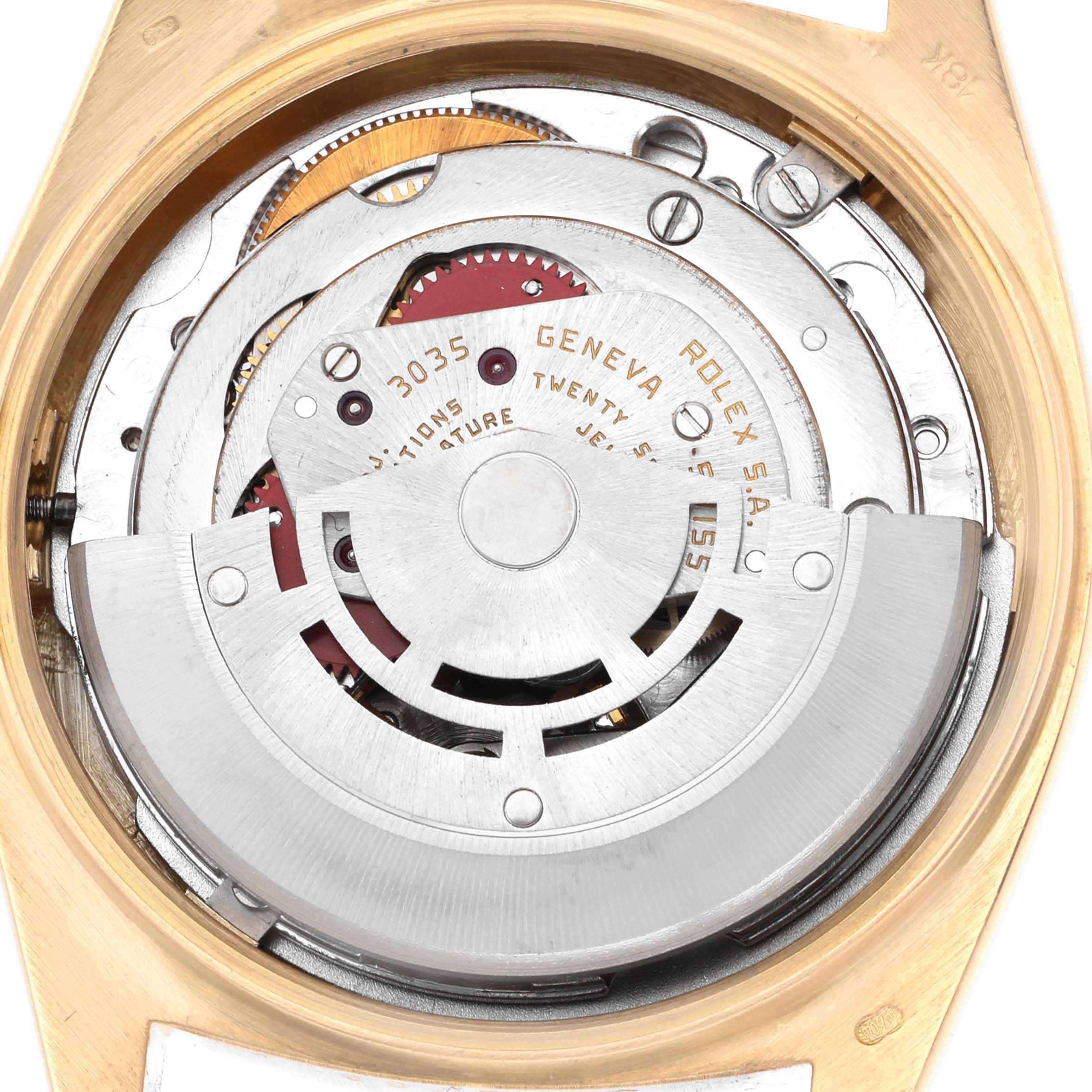 The image shows the internal mechanism of a Rolex President 18038 Men
s Yellow Gold Champagne Dial 18038 Men
s Yellow Gold Champagne Dial watch from the back, featuring gears and the rotor.