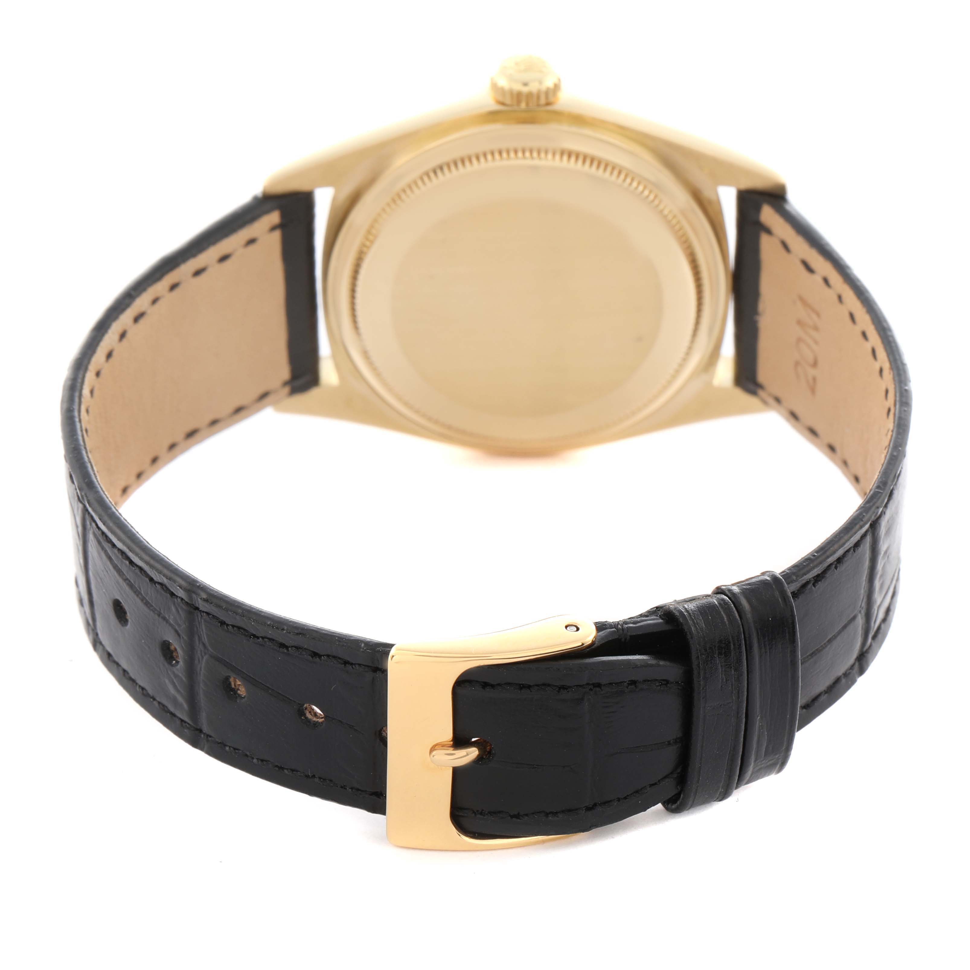 The Rolex President 18038 Men
s Yellow Gold Champagne Dial 18038 Men
s Yellow Gold Champagne Dial model is shown from the back, highlighting the case back, leather strap, and gold buckle.