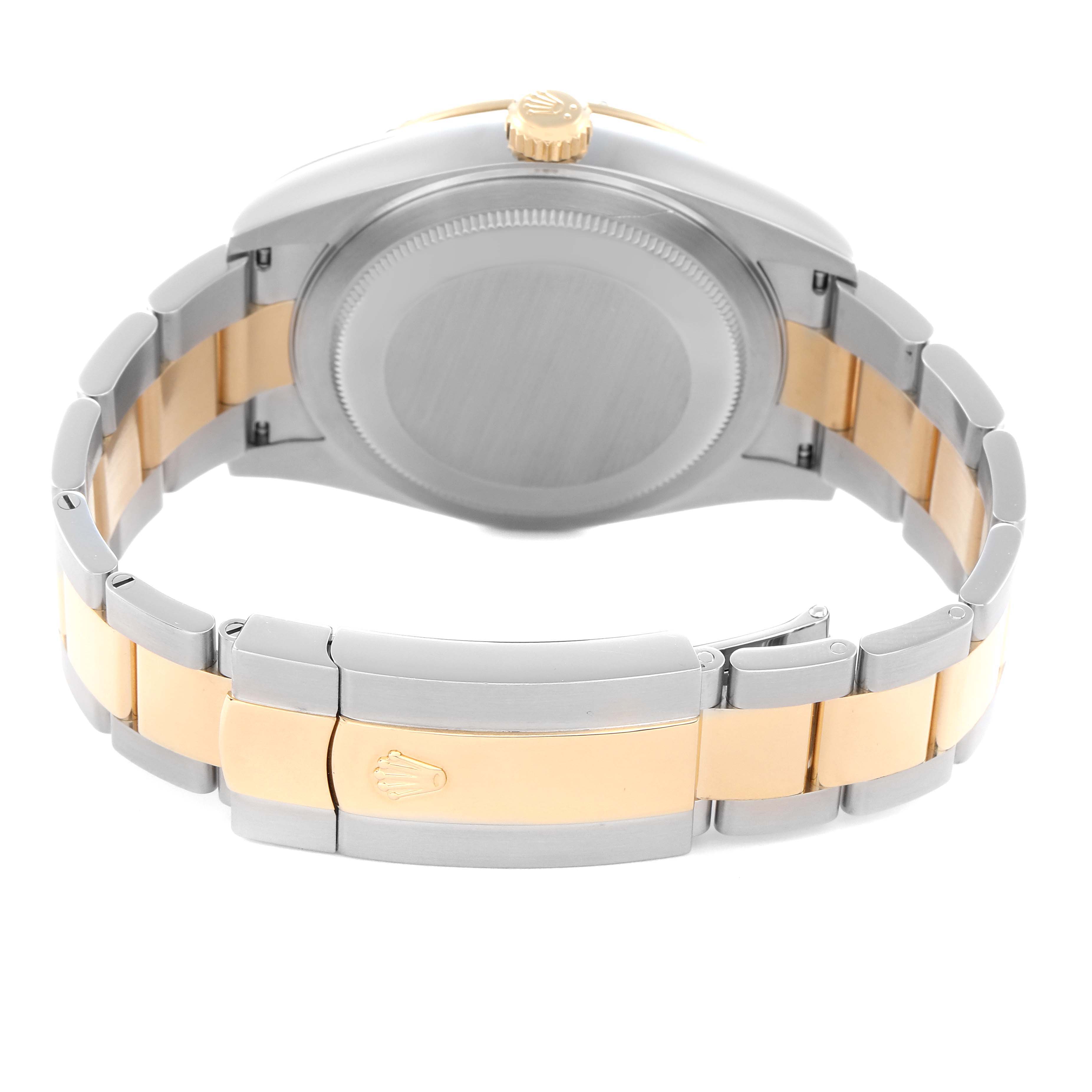 The image shows the backside of a Rolex Sky-Dweller 326933 Men
s Steel and Gold (two tone) Silver Dial 326933 Men
s Steel and Gold (two tone) Silver Dial, highlighting the case back and two-tone bracelet with a clasp.