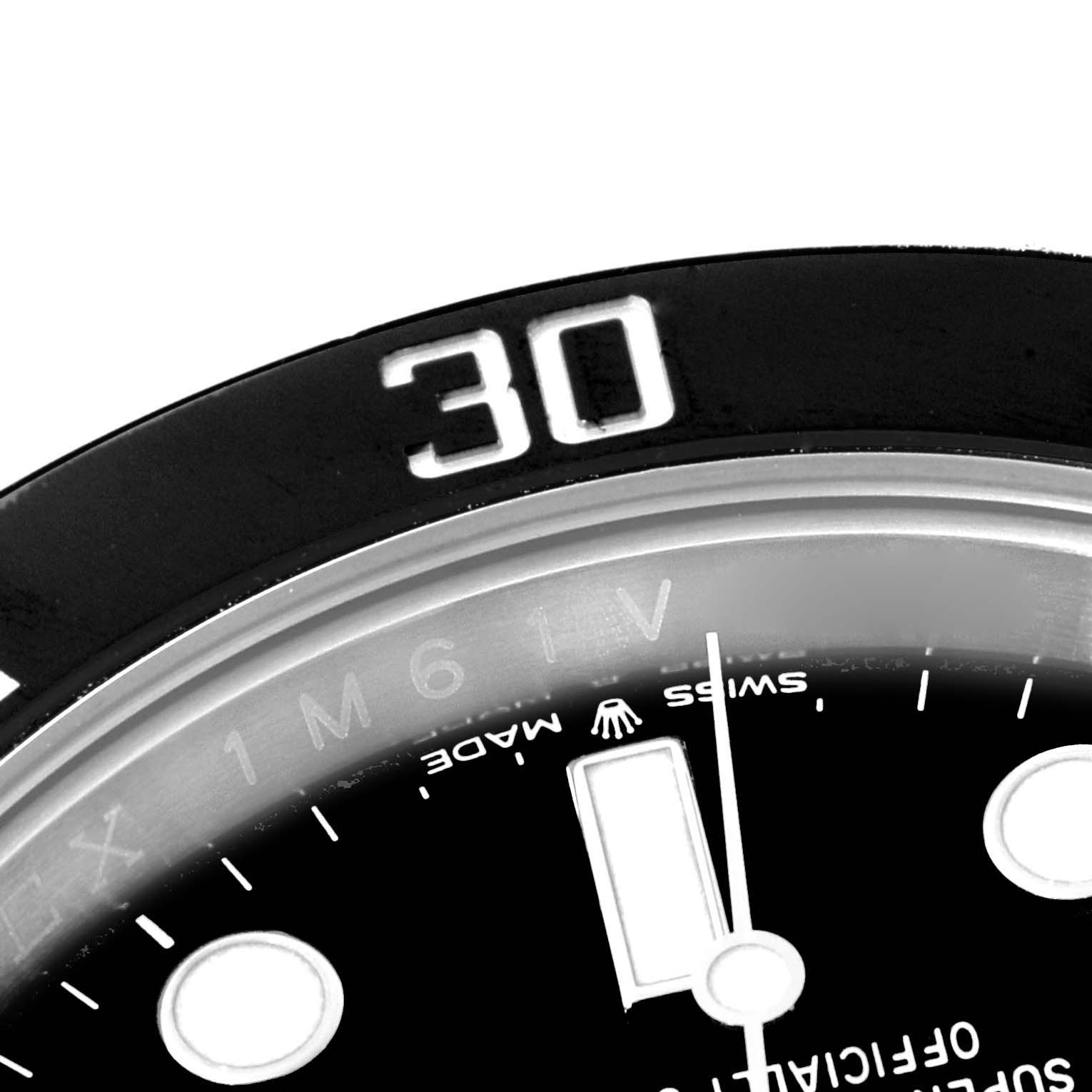 The image shows a close-up of the bezel and part of the dial of a Rolex Submariner 126610 Men
s Stainless Steel Black Dial 126610 Men
s Stainless Steel Black Dial watch, focusing on the 30-minute marker.