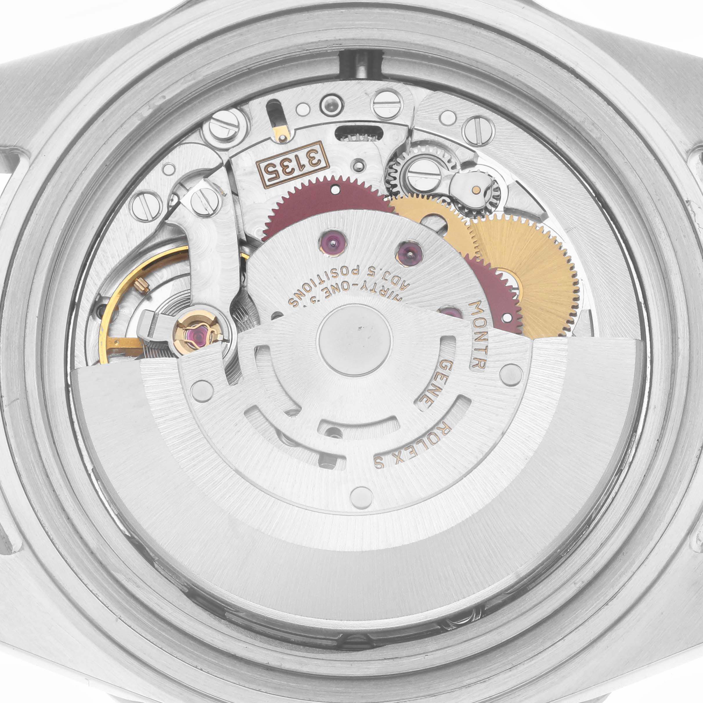 The image shows the movement of a Rolex Submariner 16610 Men
s Stainless Steel Black Dial 16610 Men
s Stainless Steel Black Dial, viewed from the back, displaying gears and rotor.